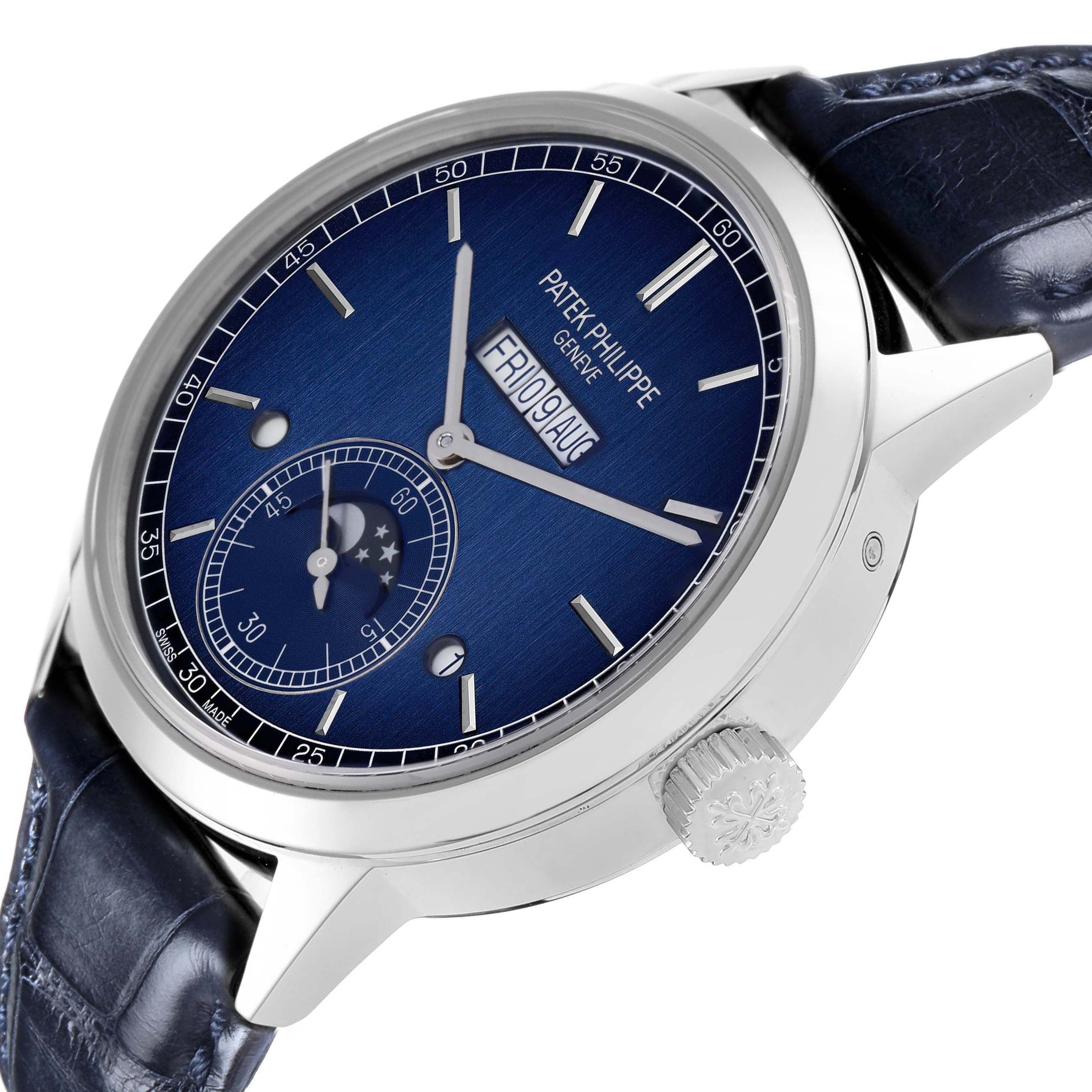 The Patek Philippe Complications 5236P-001 Men
s Platinum Blue Dial watch is shown at an angle, highlighting the blue dial, crown, and lugs.