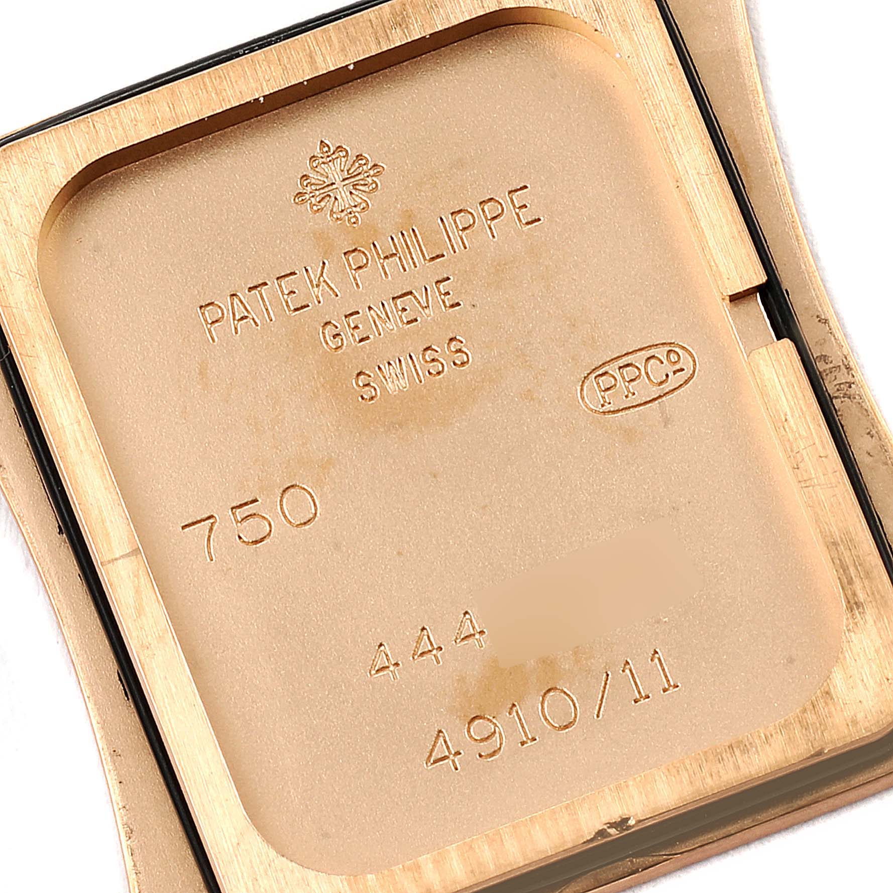 This image shows the engraved backside of the Patek Philippe Twenty-4 4910/11R Women's Rose Gold Black Dial 4910/11R Women's Rose Gold Black Dial model watch.