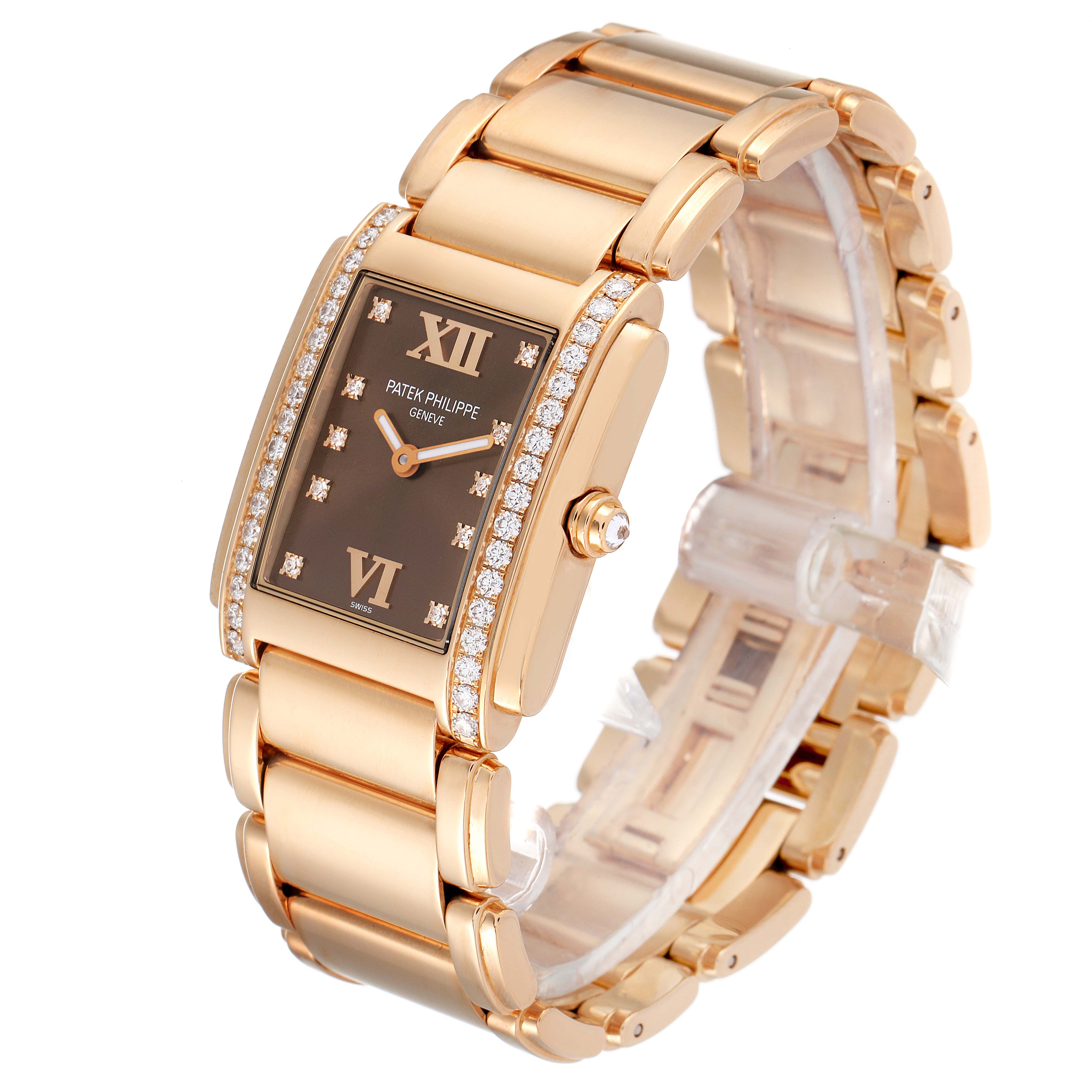 The Patek Philippe Twenty-4 4910/11R Women's Rose Gold Brown Dial 4910/11R Women's Rose Gold Brown Dial watch is shown at an angled view with its face, bracelet, and crown visible.