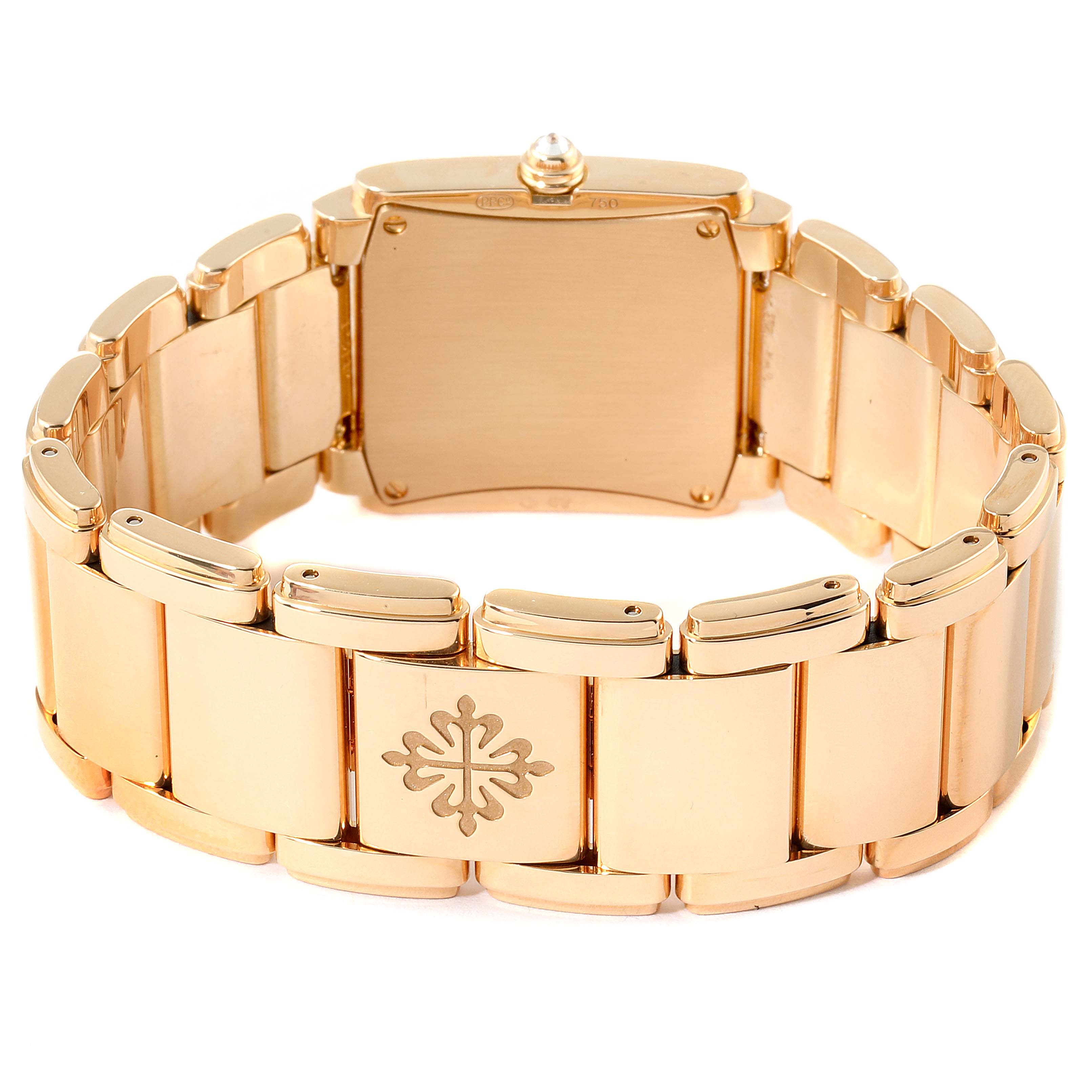 The image shows the back view of a Patek Philippe Twenty-4 4910/11R Women's Rose Gold Brown Dial 4910/11R Women's Rose Gold Brown Dial watch, highlighting the gold bracelet and clasp.