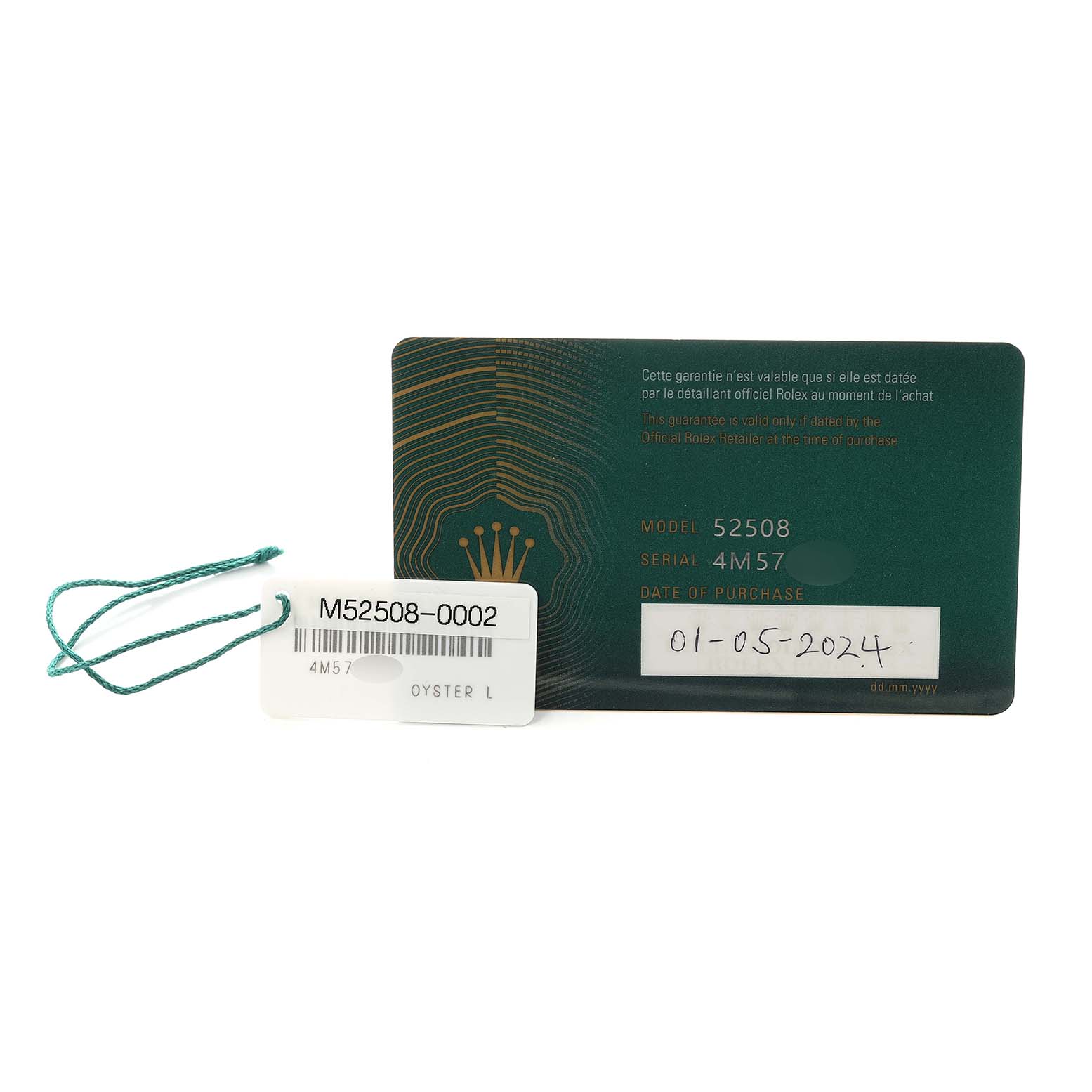 The image shows a green Rolex warranty card for the 1908 model alongside a hang tag with model and serial information.