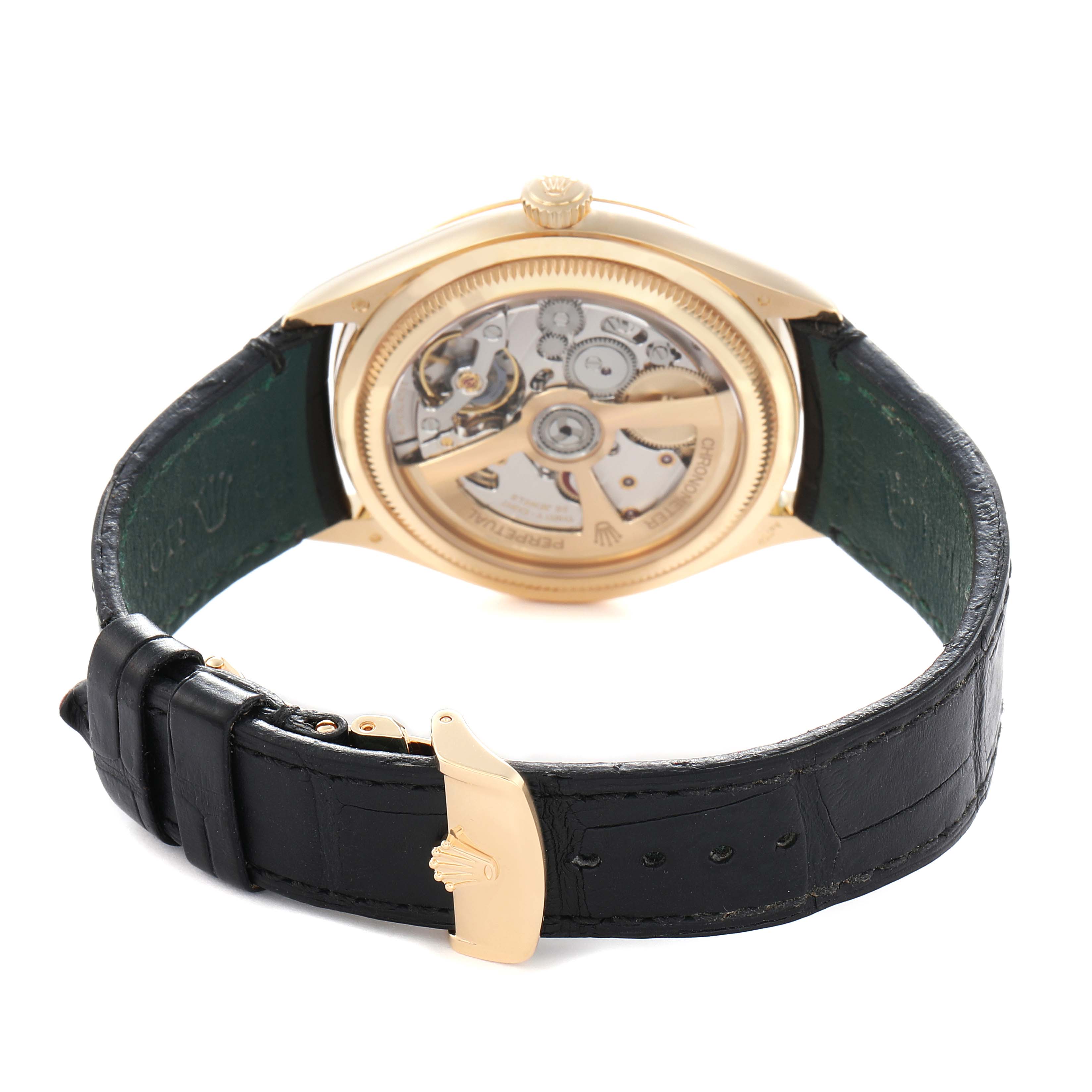 The image shows a Rolex 1908 52508 Men
s Yellow Gold Black Dial model from the back, displaying the movement and rotor with a black leather strap.