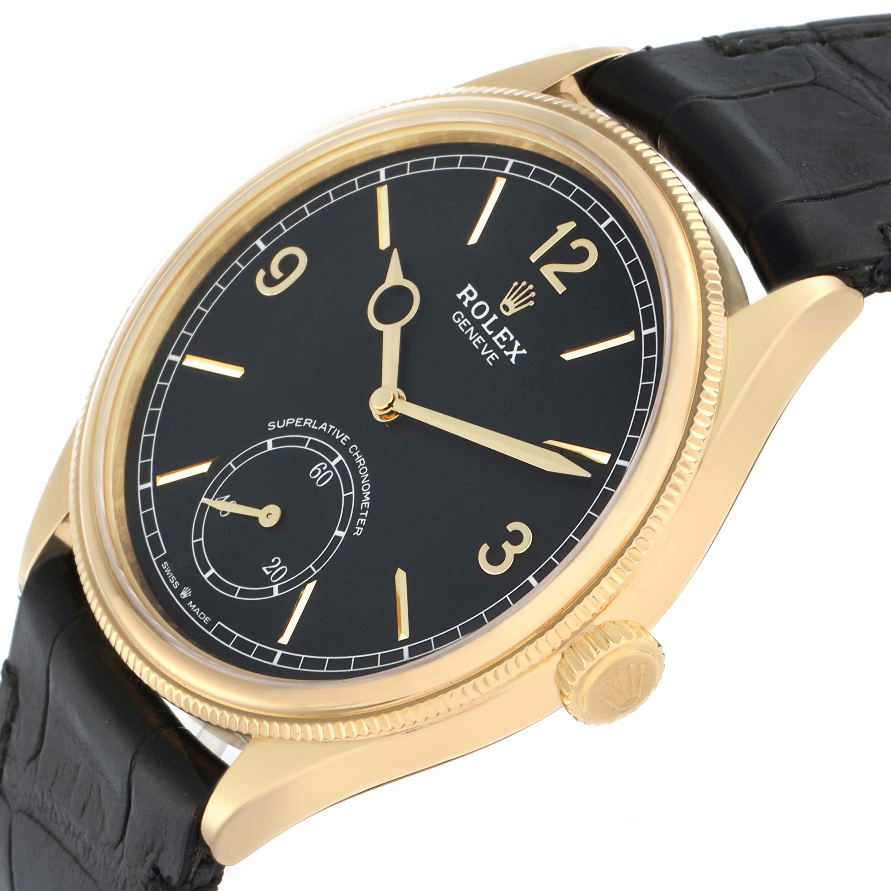 The Rolex 1908 52508 Men
s Yellow Gold Black Dial model is shown at an angled view highlighting the black dial, gold case, and crown, with a black leather strap.