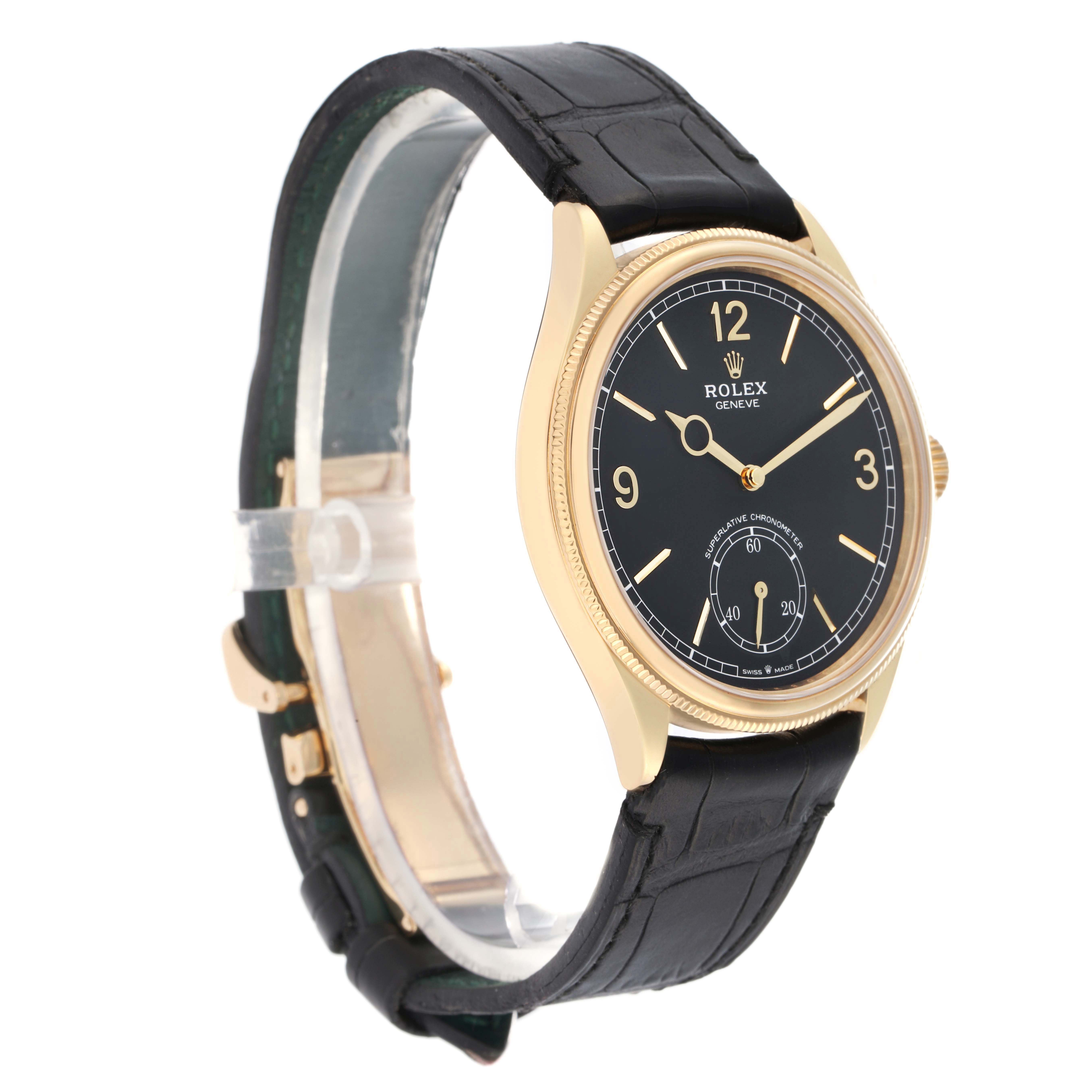 The Rolex 1908 52508 Men
s Yellow Gold Black Dial watch is shown at a three-quarter angle, displaying the gold case, black dial, and strap clearly.