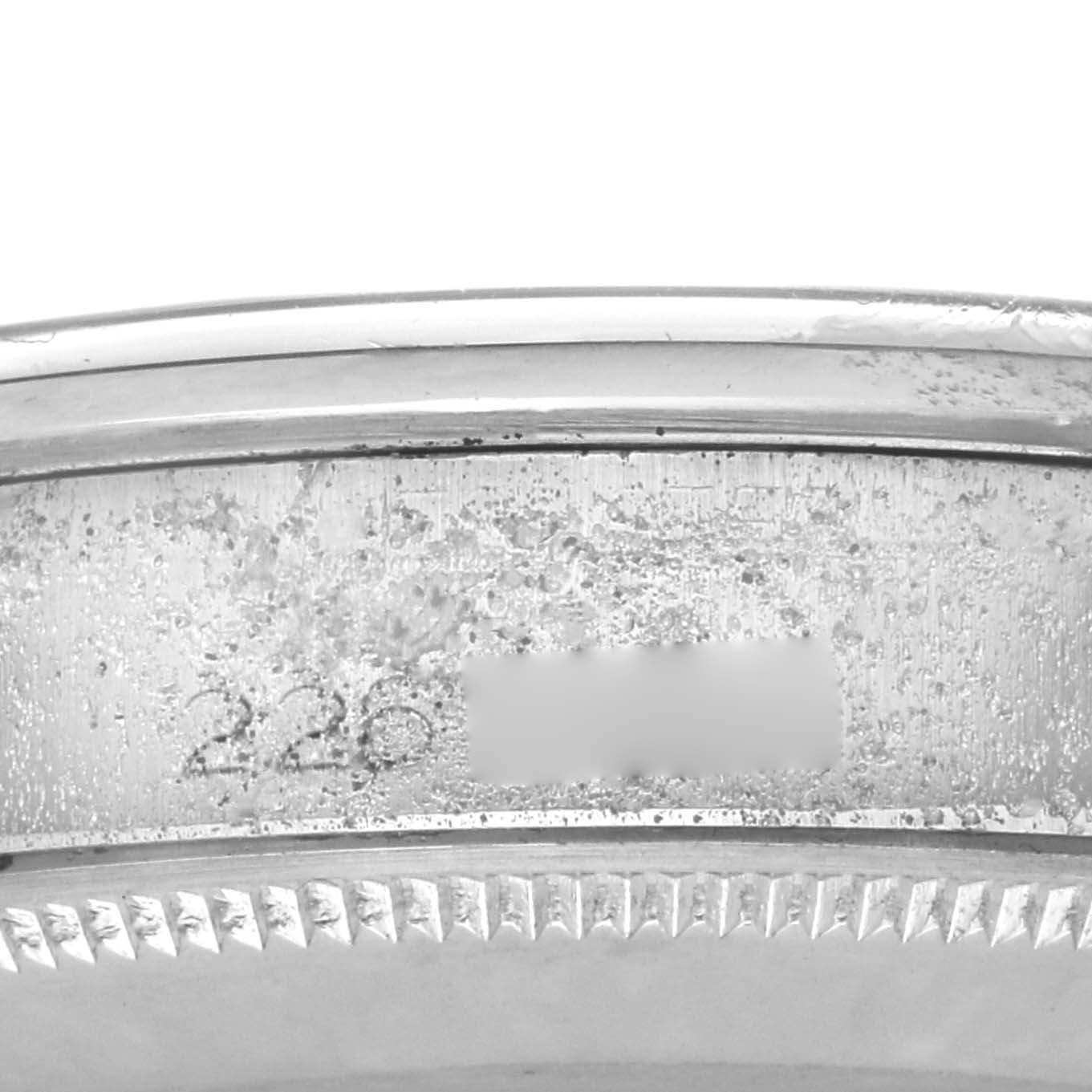 The image shows the engraved side of a Rolex Vintage Collection 5500 Men
s Stainless Steel Silver Dial watch case with detailed grooves.