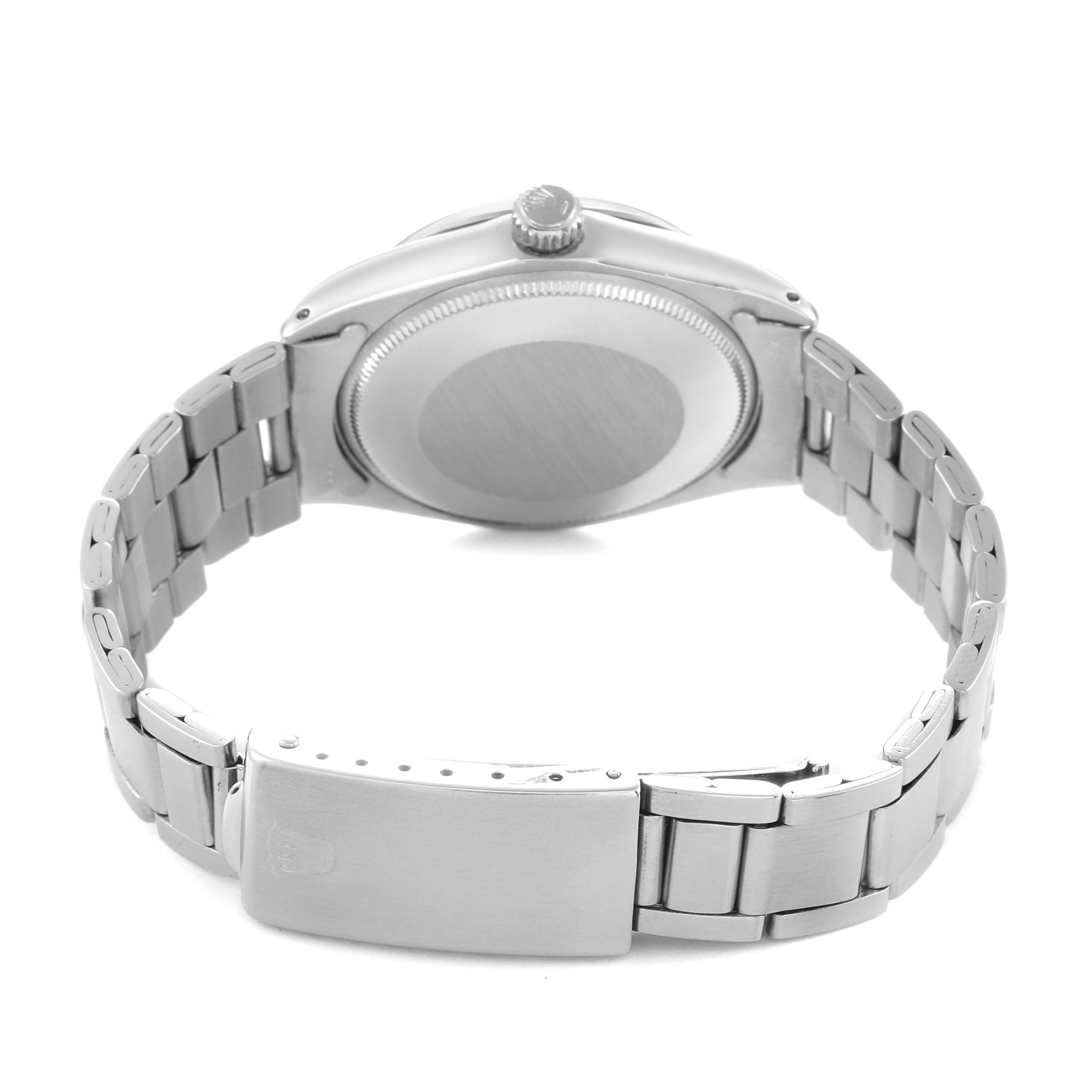 The Rolex Vintage Collection 5500 Men
s Stainless Steel Silver Dial watch is shown from the back, highlighting the case back, crown, and stainless steel bracelet with the clasp.