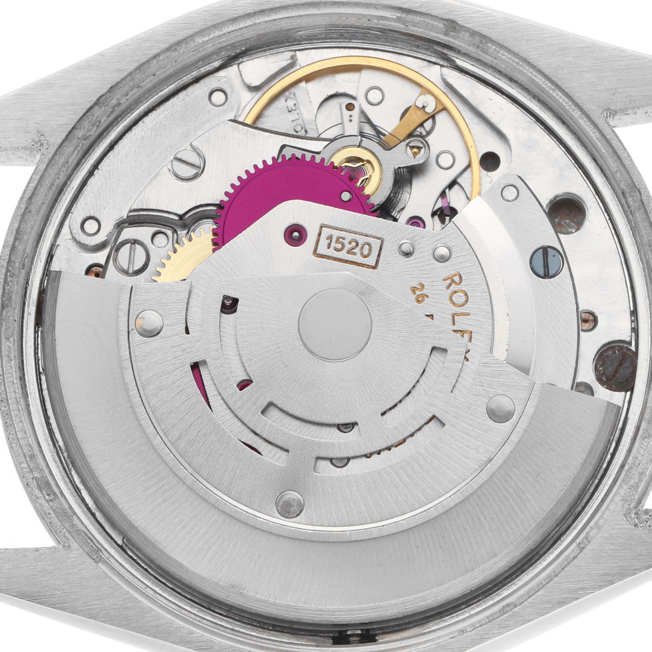 The image shows the internal movement of a Rolex Vintage Collection 5500 Men
s Stainless Steel Silver Dial watch, highlighting gears, the rotor, and balance wheel.