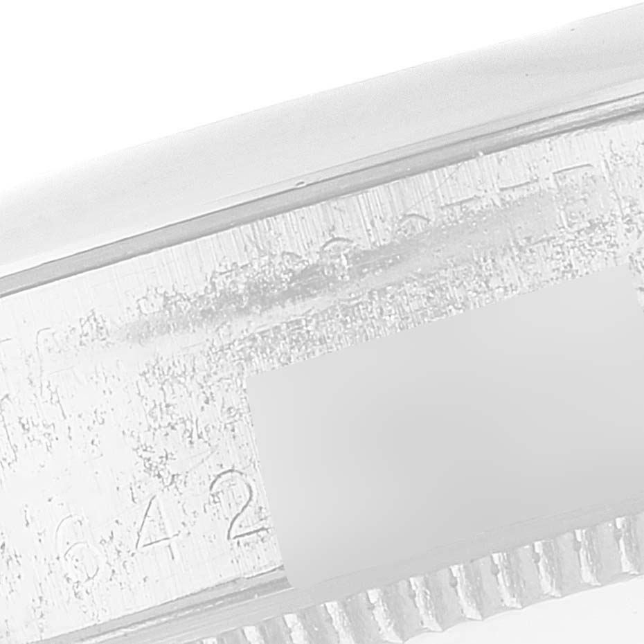 This image shows a close-up of the side of a Rolex Vintage Collection 5500 Men
s Stainless Steel Silver Dial 5500 Men
s Stainless Steel Silver Dial watch, focusing on its serial number engraving.