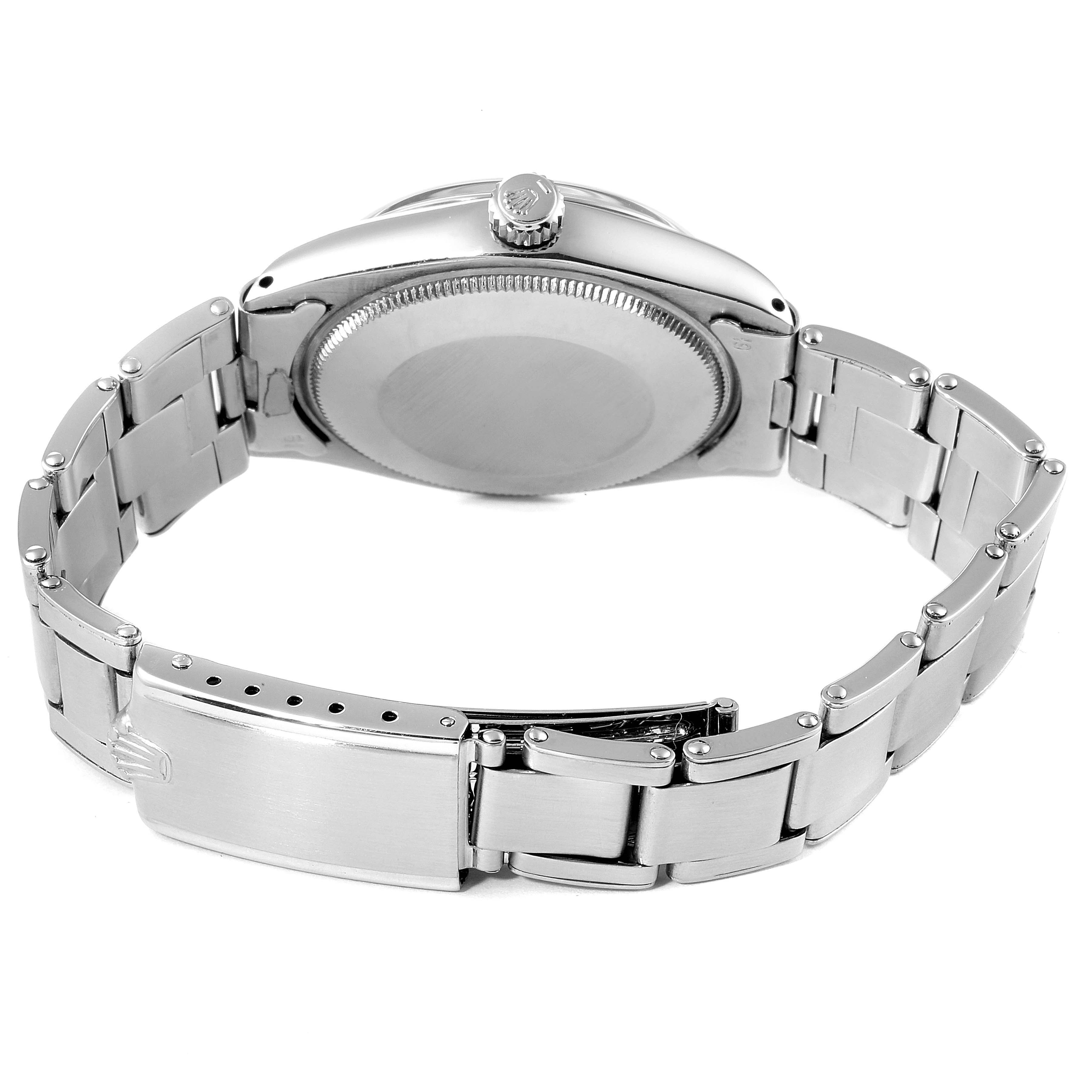 The image shows the back view and the bracelet of a Rolex Vintage Collection 5500 Men
s Stainless Steel Silver Dial 5500 Men
s Stainless Steel Silver Dial watch.