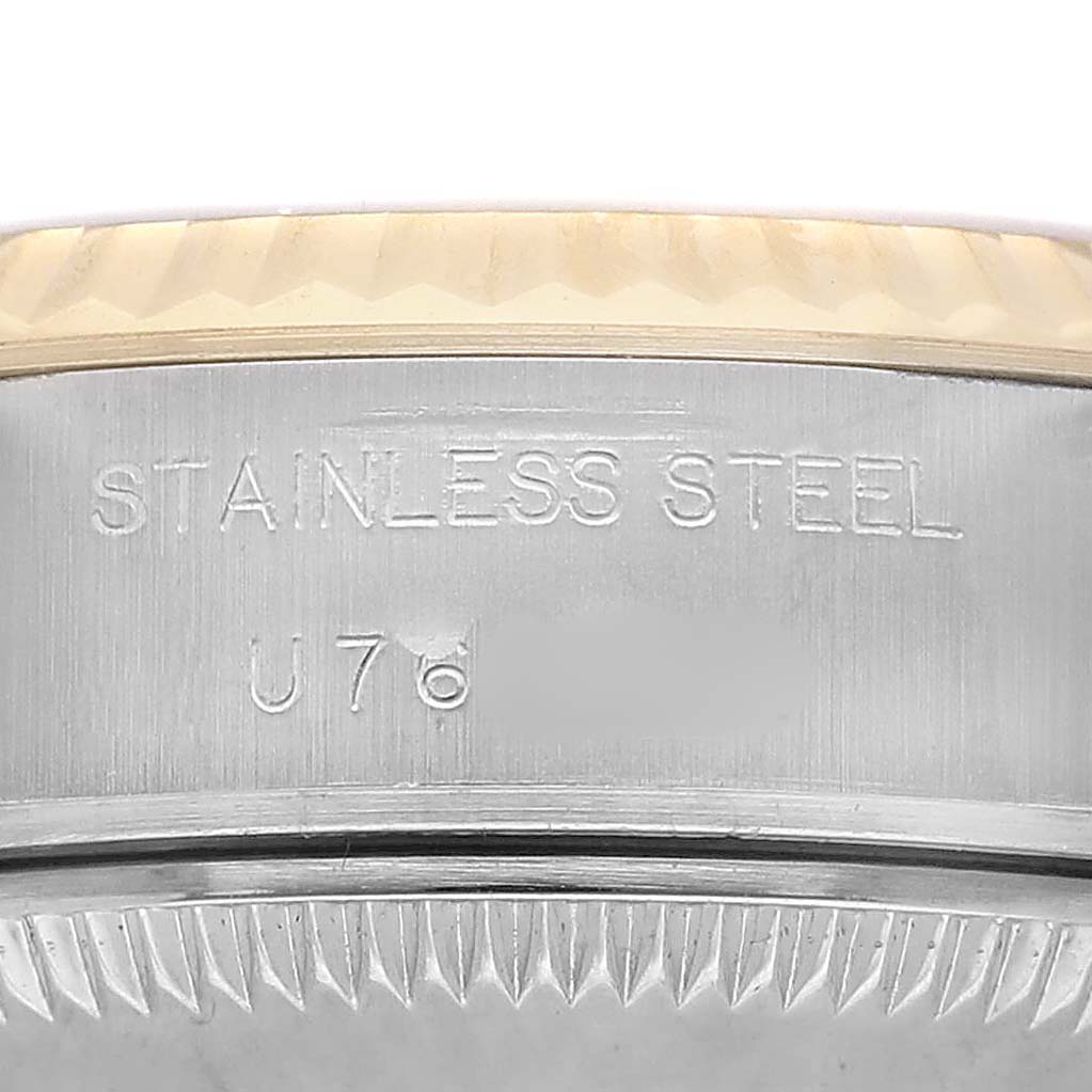 The image shows a close-up of the case side of a Rolex Datejust 69173 Women's Steel and Gold (two tone) Champagne Dial, highlighting the stainless steel engraving.