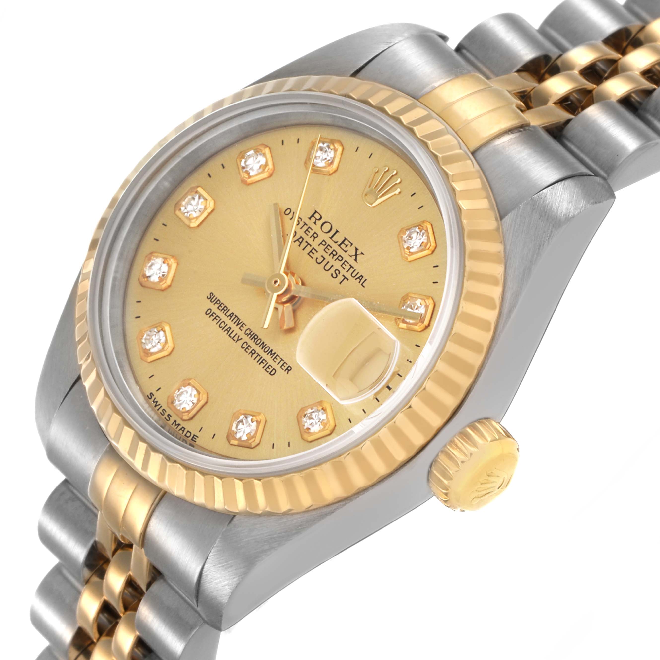 The Rolex Datejust 69173 Women's Steel and Gold (two tone) Champagne Dial watch is shown at an angled view highlighting its gold bezel, dial, and two-tone bracelet.