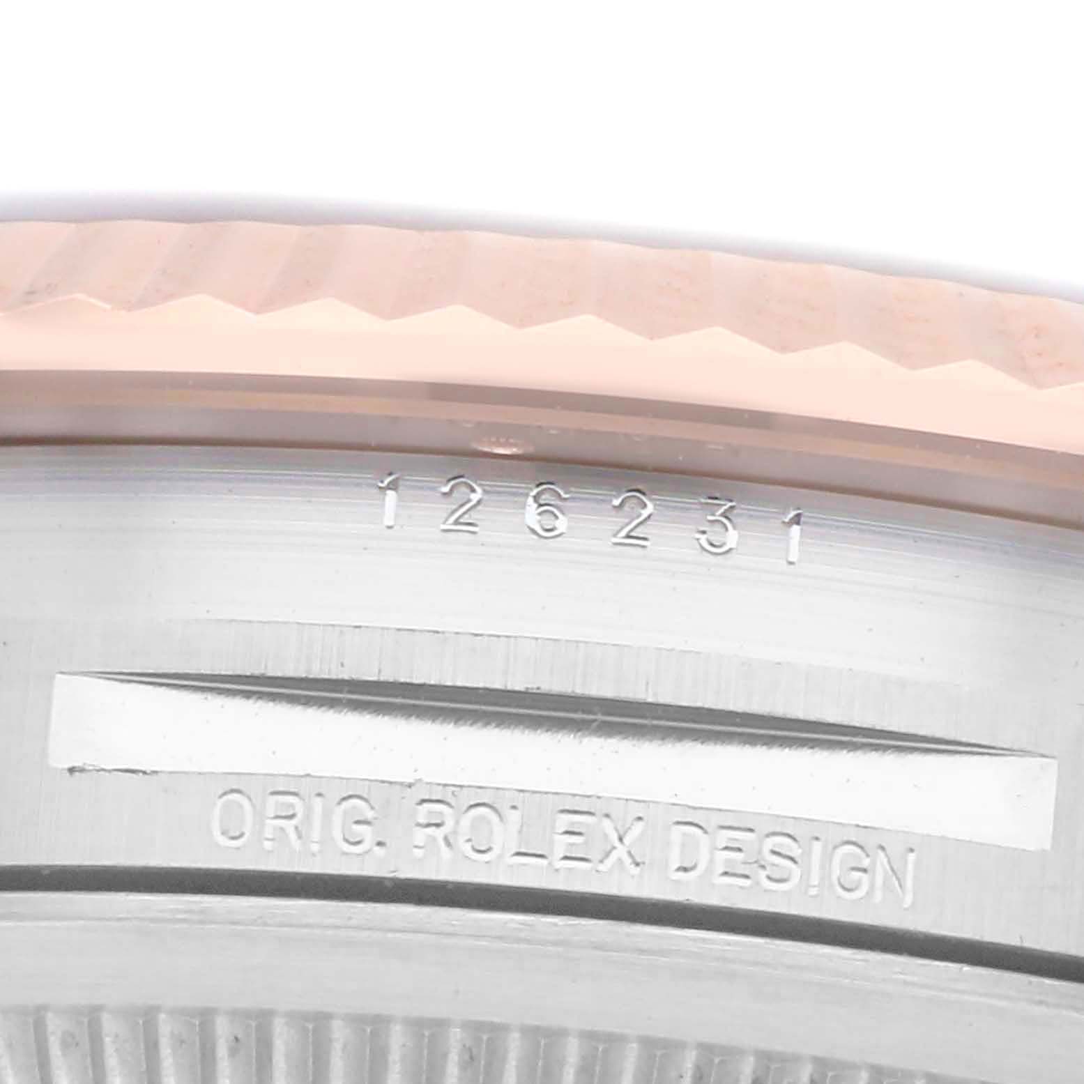 The image shows the side of a Rolex Datejust 126231 Men
s Steel and Gold (two tone) Black Dial watch case, highlighting the model number and "ORIG. ROLEX DESIGN" engraving.