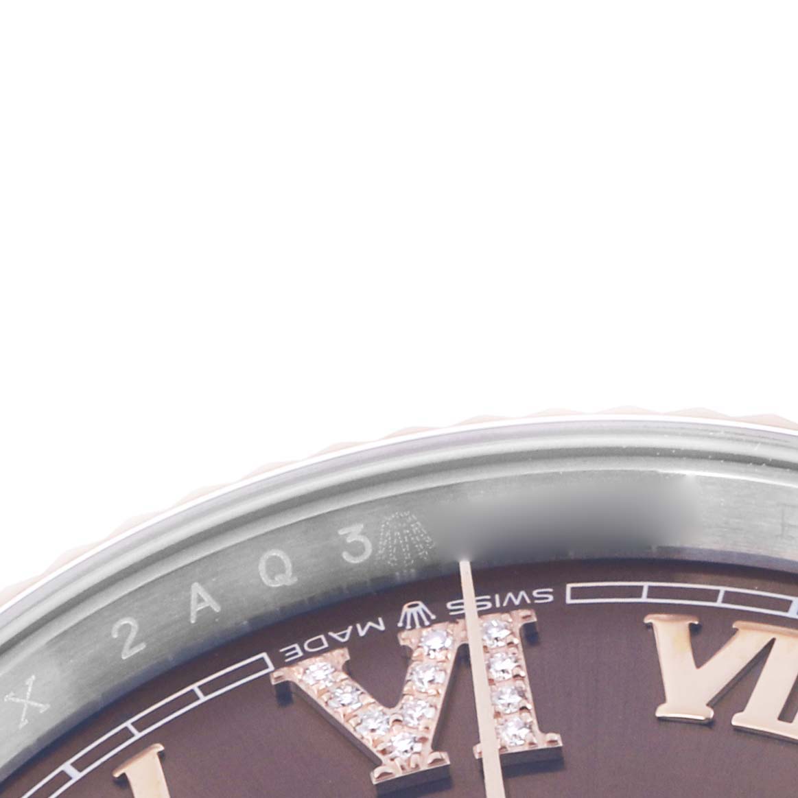 The image shows a close-up of the dial and bezel of a Rolex Datejust 126231 Men
s Steel and Gold (two tone) Brown Dial, focusing on the Roman numeral "VI" with diamonds.