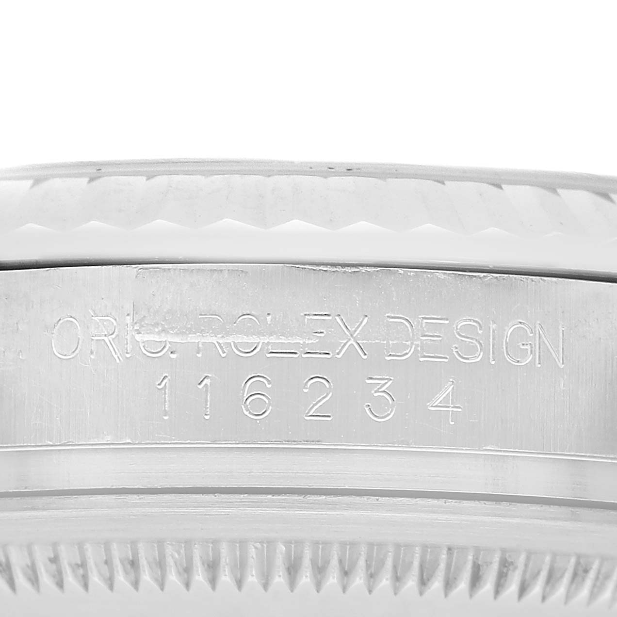 The image shows a close-up side view of the bezel and engraved serial number on a Rolex Datejust 116234 Men's Stainless Steel Silver Dial.