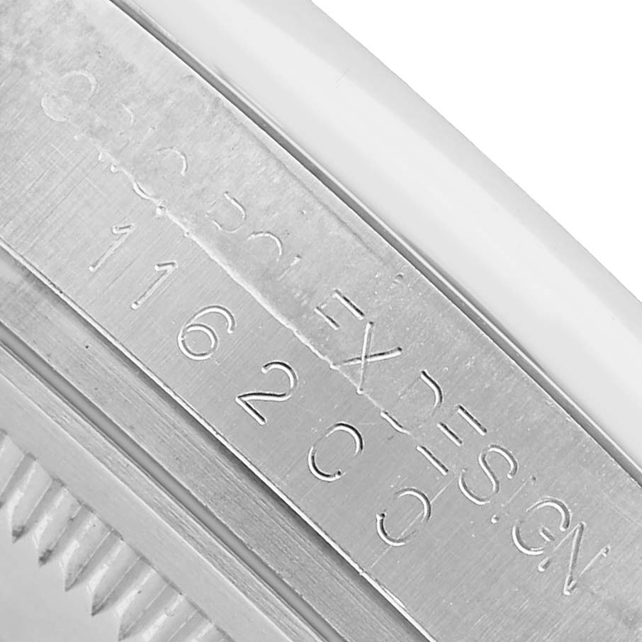 The image shows a close-up of the side of a Rolex Datejust 116200 Men's Stainless Steel White Dial watch, highlighting the engraved model number and design details.