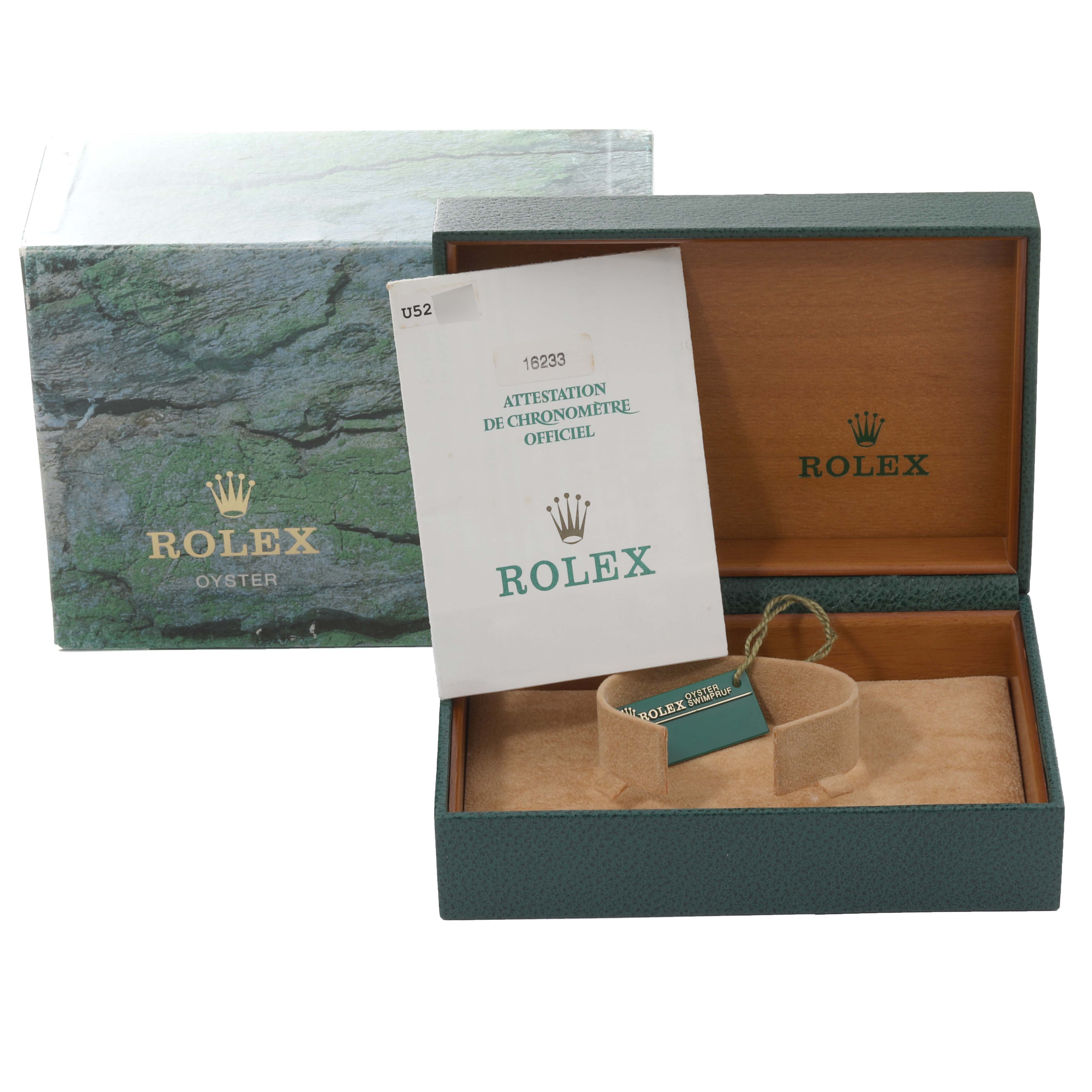 The image shows the packaging of a Rolex Datejust 16233 Men's Steel and Gold (two tone) Black Dial 16233 Men's Steel and Gold (two tone) Black Dial, including the outer box, inner box, and official chronometer certification.