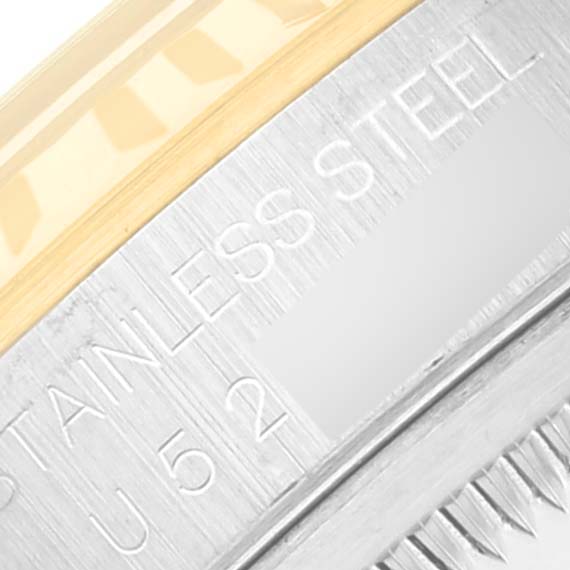 Close-up of a Rolex Datejust 16233 Men's Steel and Gold (two tone) Black Dial 16233 Men's Steel and Gold (two tone) Black Dial watch showing the stainless steel case with partial visibility of engraved text.