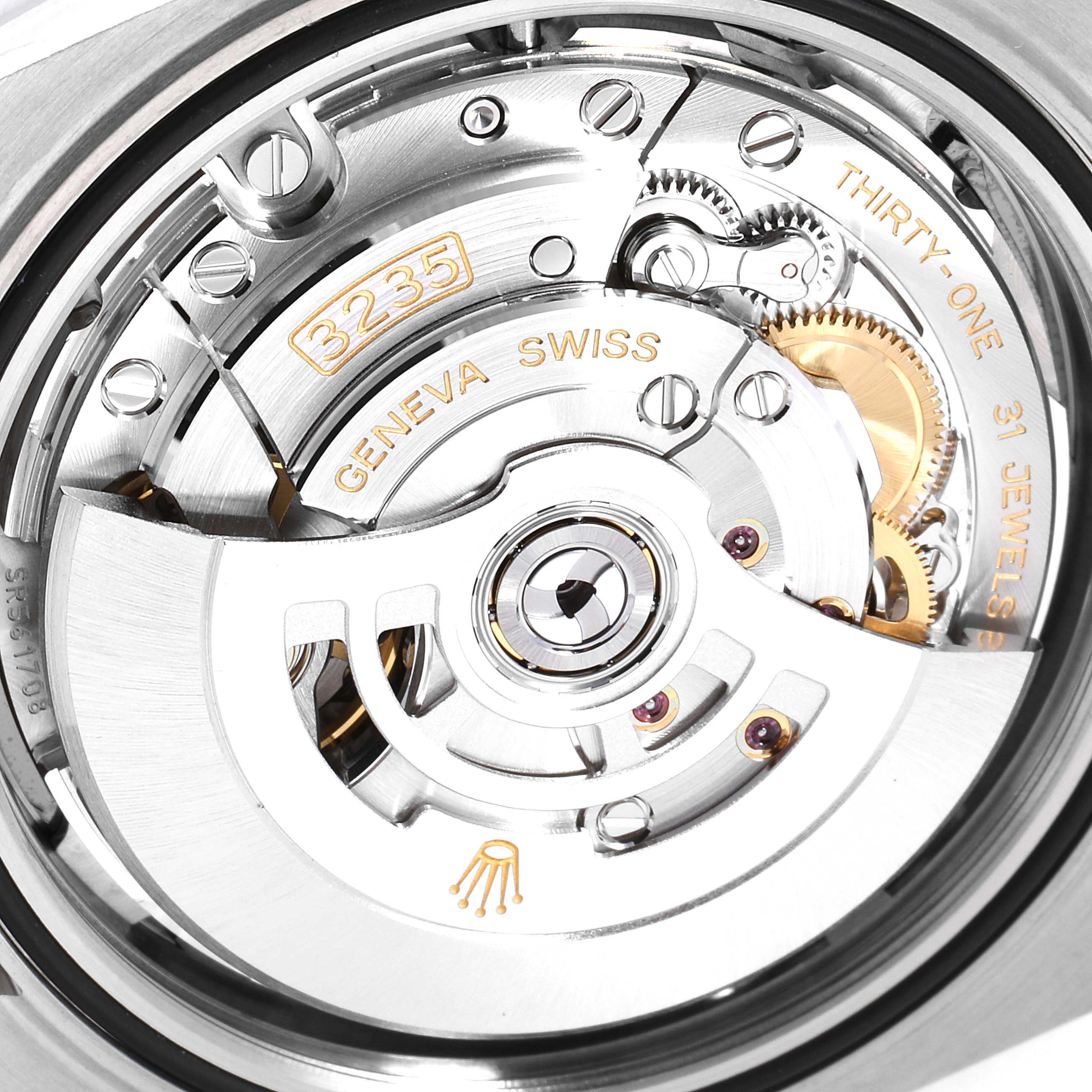 The image shows the movement mechanism of a Rolex Datejust 41 126300 Men
s Stainless Steel Blue Dial 126300 Men
s Stainless Steel Blue Dial, highlighting the 3235 caliber and parts like gears and jewels.