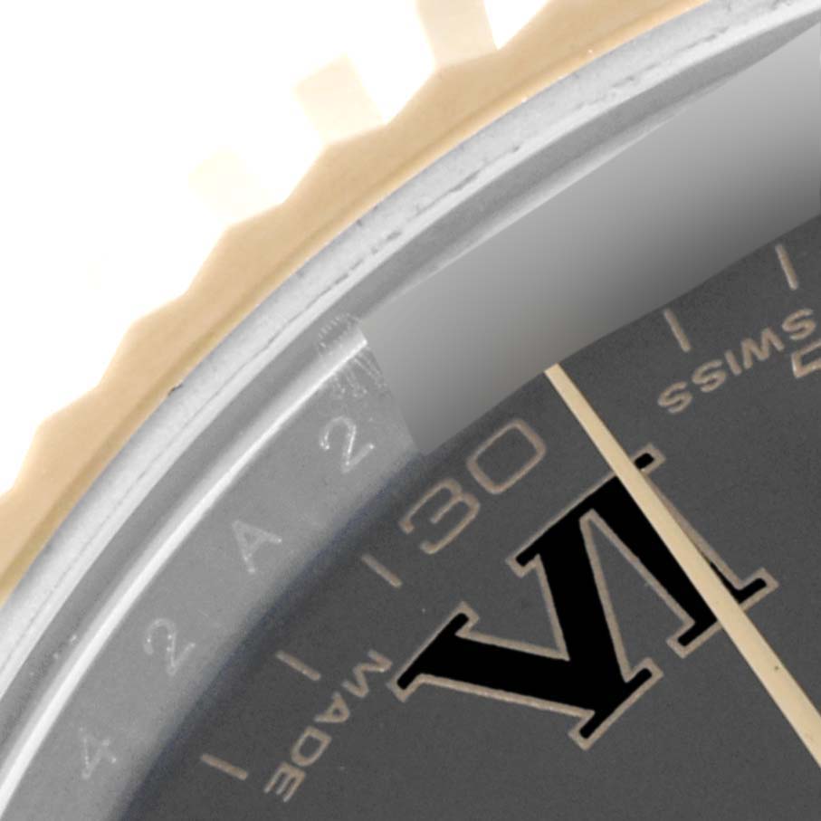 The image shows a close-up of the bezel and partial dial of a Rolex Datejust 41 116333 Men's Steel and Gold (two tone) Black Dial 116333 Men's Steel and Gold (two tone) Black Dial watch, focusing on the "VI" numeral and minute markers.