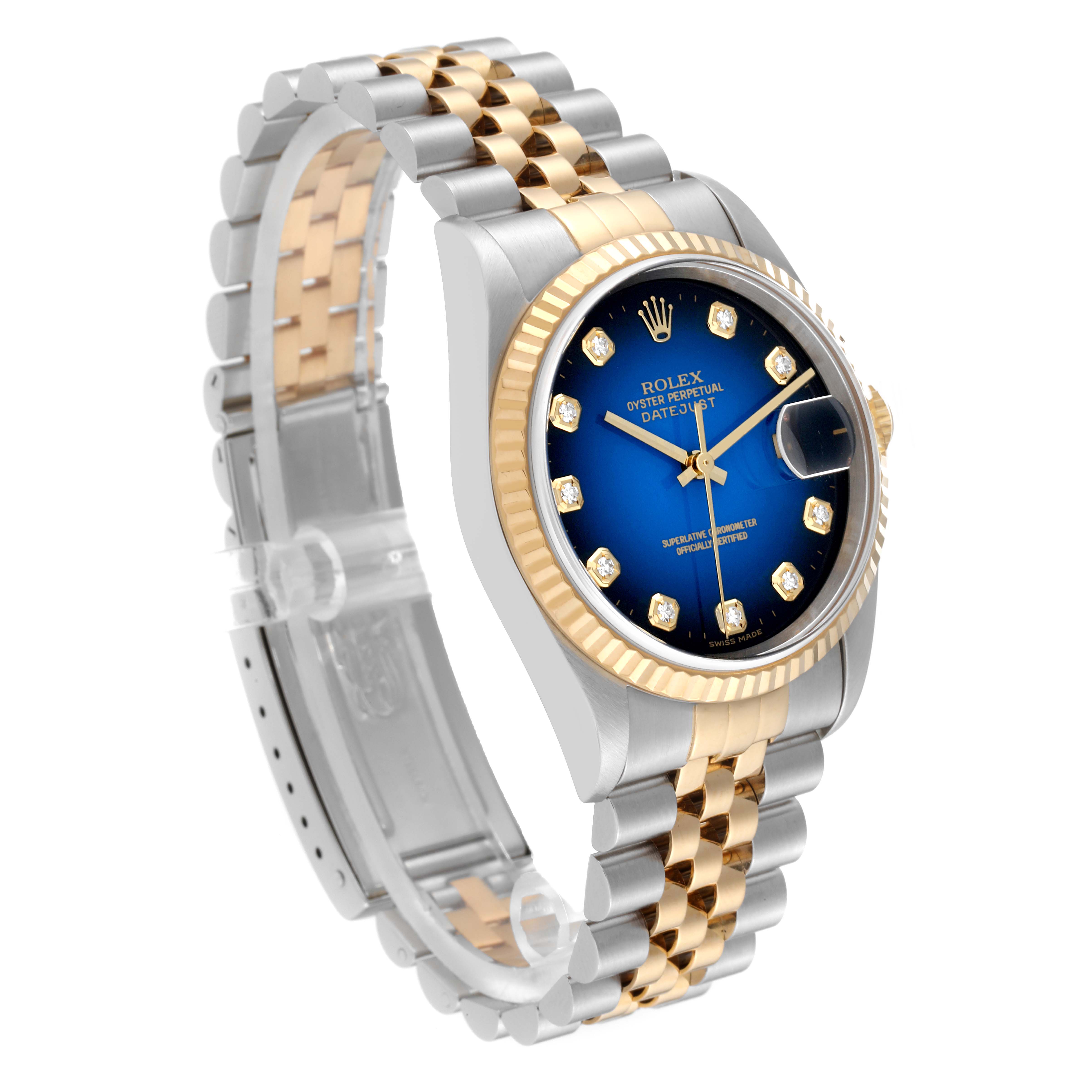 This image shows a Rolex Datejust 16233 Men's Steel and Gold (two tone) Blue Dial 16233 Men's Steel and Gold (two tone) Blue Dial model watch at a three-quarter angle, highlighting its blue dial, two-tone bracelet, and fluted bezel.