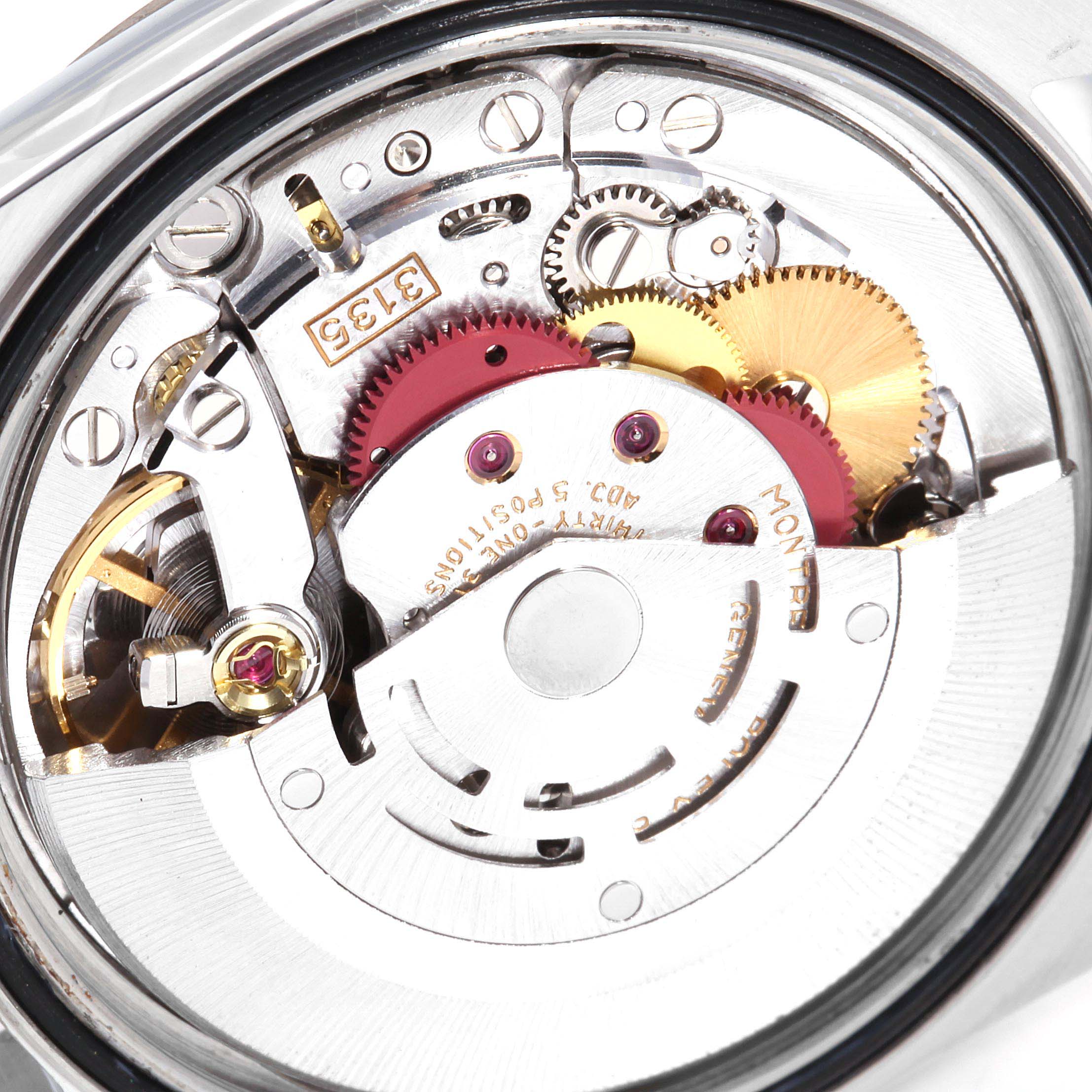The image shows a close-up view of the inner mechanical movement of a Rolex Datejust 16234 Men's Stainless Steel Silver Dial 16234 Men's Stainless Steel Silver Dial watch, highlighting gears and intricate components.
