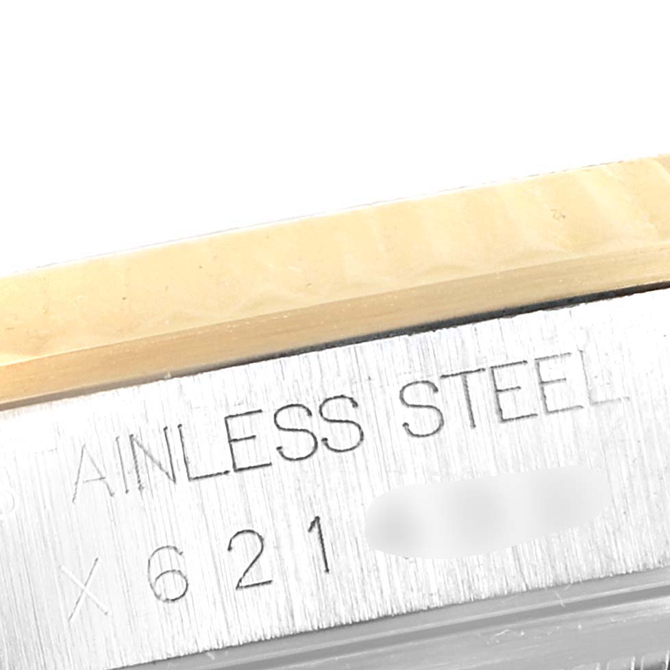 The image shows a close-up angle of the serial number and "STAINLESS STEEL" engraving on a Rolex Datejust 16233 Men's Steel and Gold (two tone) Champagne Dial 16233 Men's Steel and Gold (two tone) Champagne Dial model watch.