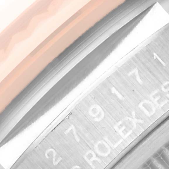 This image shows a close-up of the bezel and part of the case side of a Rolex Datejust 279171 Women's Steel and Gold (two tone) Green Dial 279171 Women's Steel and Gold (two tone) Green Dial watch.