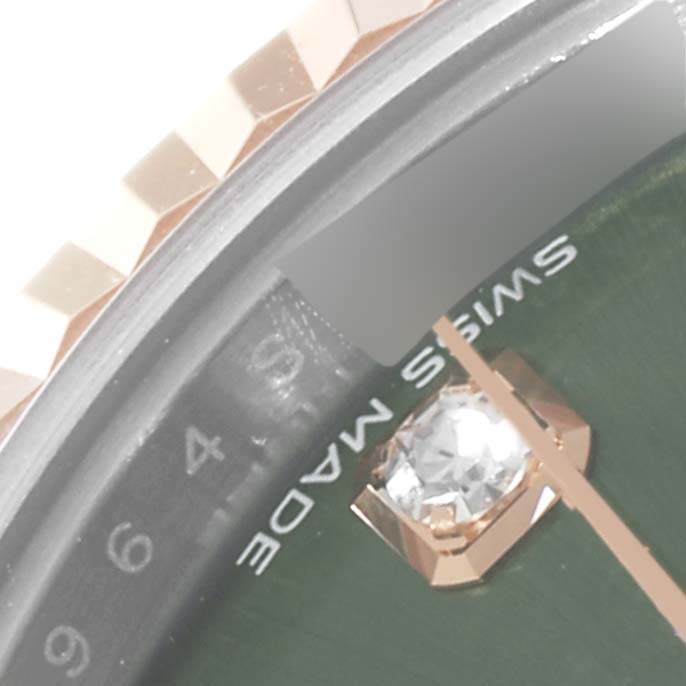 The image shows a close-up of the dial and bezel of a Rolex Datejust 279171 Women's Steel and Gold (two tone) Green Dial 279171 Women's Steel and Gold (two tone) Green Dial watch, highlighting the "Swiss Made" text and part of a diamond marker.