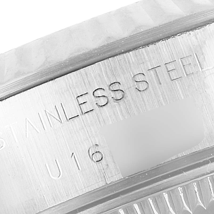 The image shows a close-up of the side of a Rolex Datejust 69174 Women's Stainless Steel Blue Dial 69174 Women's Stainless Steel Blue Dial watch case, specifically highlighting the stainless steel engraving.