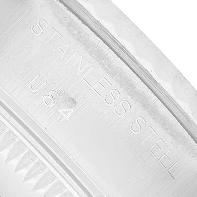The image shows a close-up of the stainless steel case back of a Rolex Datejust 69174 Women's Stainless Steel Pink Dial watch, highlighting the engraved text.