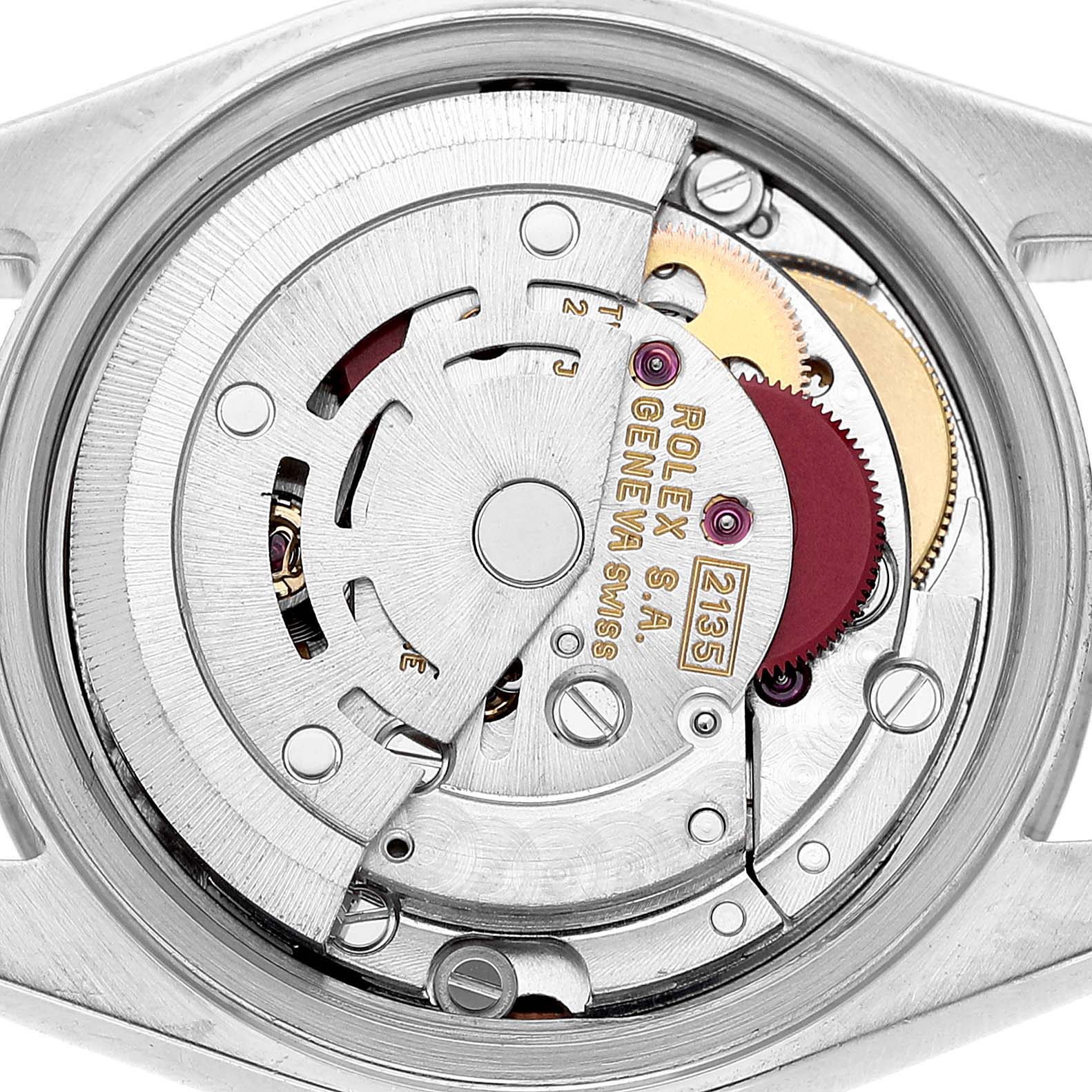The image shows the movement of a Rolex Datejust 69174 Women's Stainless Steel Pink Dial watch from a top-down angle, highlighting the intricate mechanics inside.