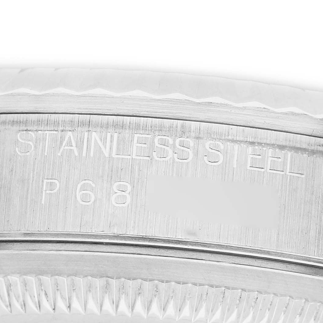 The image shows a close-up of the side of the Rolex Datejust 16234 Men's Stainless Steel Silver Dial watch case with "STAINLESS STEEL" engraving.