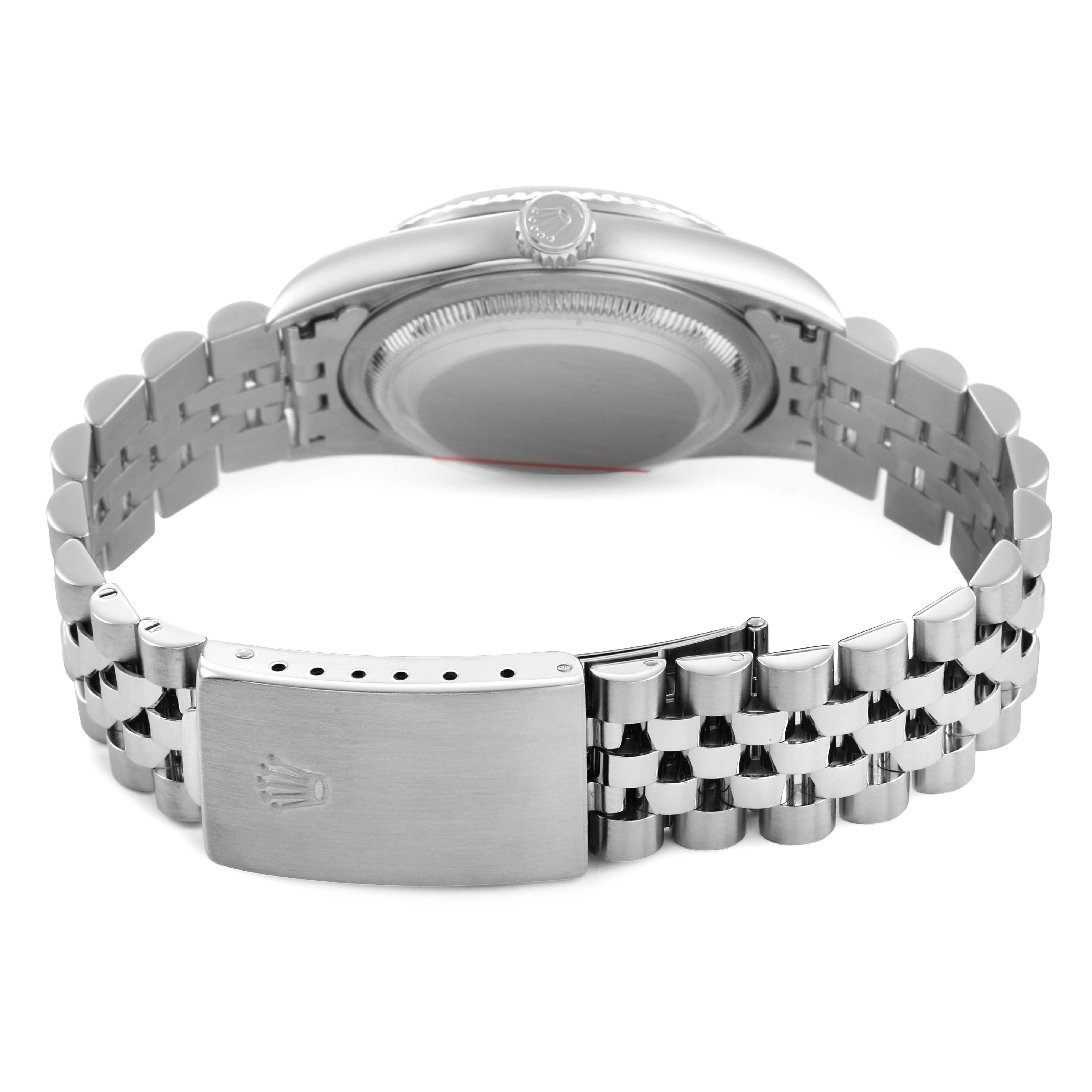 The Rolex Datejust 16234 Men's Stainless Steel Silver Dial watch is shown from the back, highlighting the bracelet and clasp with the crown logo detail.