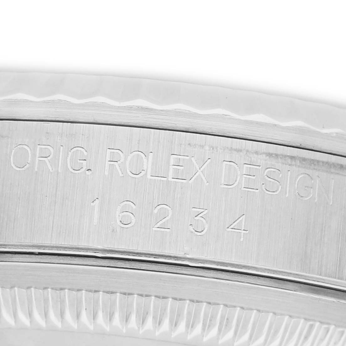The image shows the case side of a Rolex Datejust 16234 Men's Stainless Steel Silver Dial, highlighting the engraved model number and "Orig. Rolex Design."