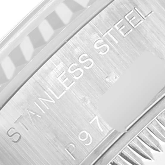 This close-up image shows the inner rim of the bezel and case of a Rolex Datejust 79174 Women's Stainless Steel Mother of Pearl Dial 79174 Women's Stainless Steel Mother of Pearl Dial watch, featuring "STAINLESS STEEL" engraving.