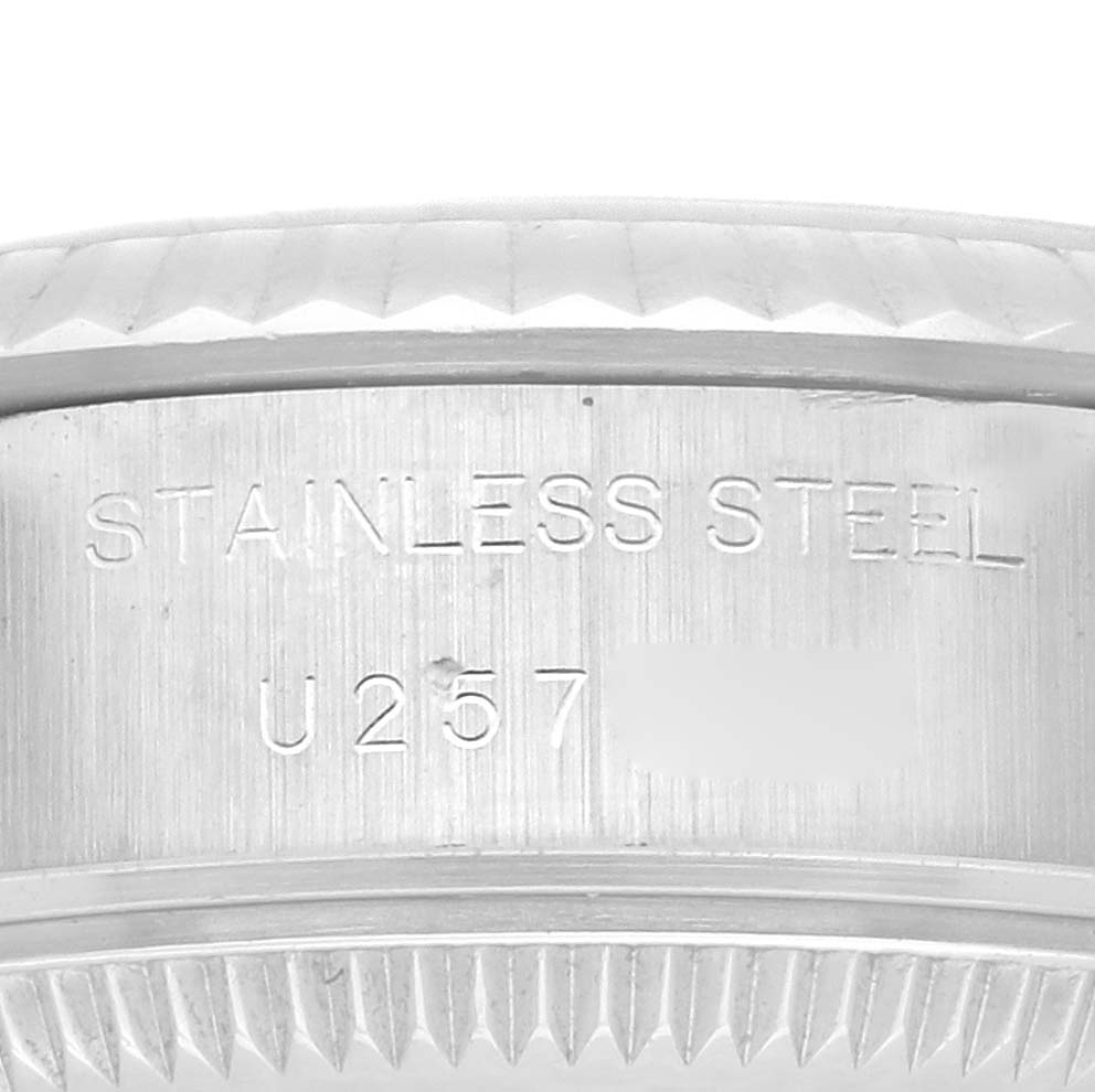 This image shows a close-up of the stainless steel case back of a Rolex Datejust 69174 Women's Stainless Steel Pink Dial 69174 Women's Stainless Steel Pink Dial watch, highlighting the engraved text.