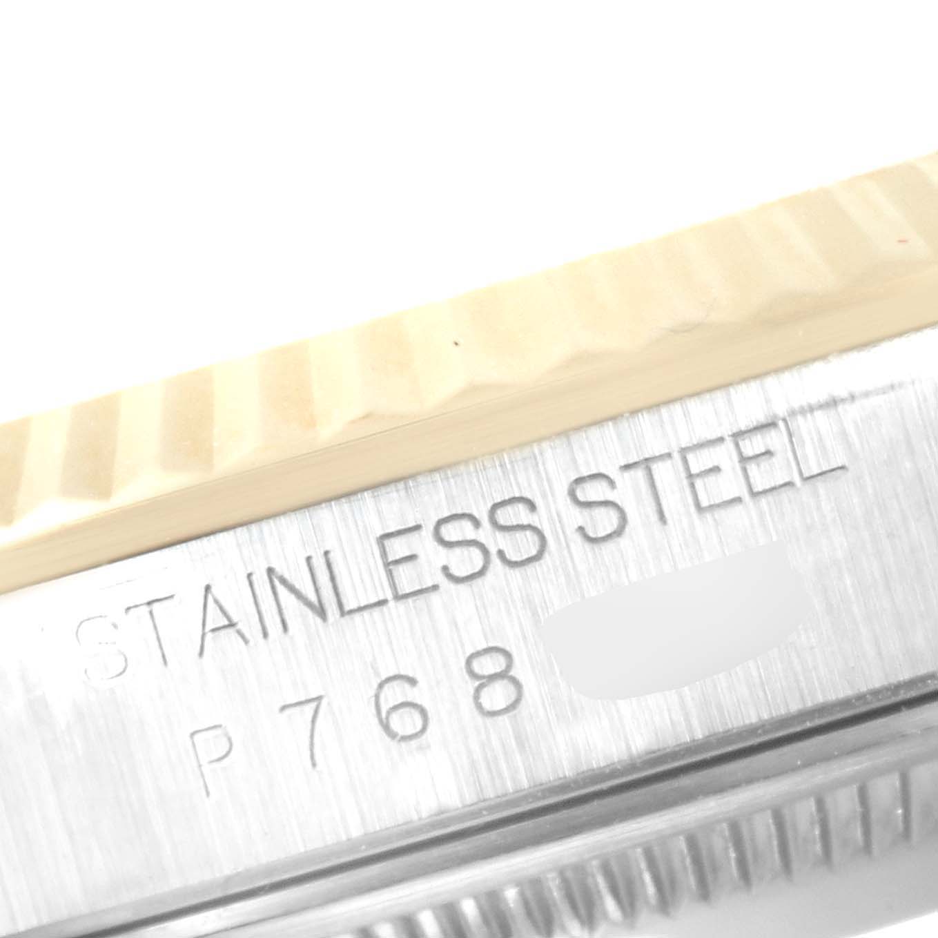 The image shows a close-up of the stainless steel watch case and fluted bezel of a Rolex Datejust 16233 Men's Steel and Gold (two tone) Champagne Dial 16233 Men's Steel and Gold (two tone) Champagne Dial.