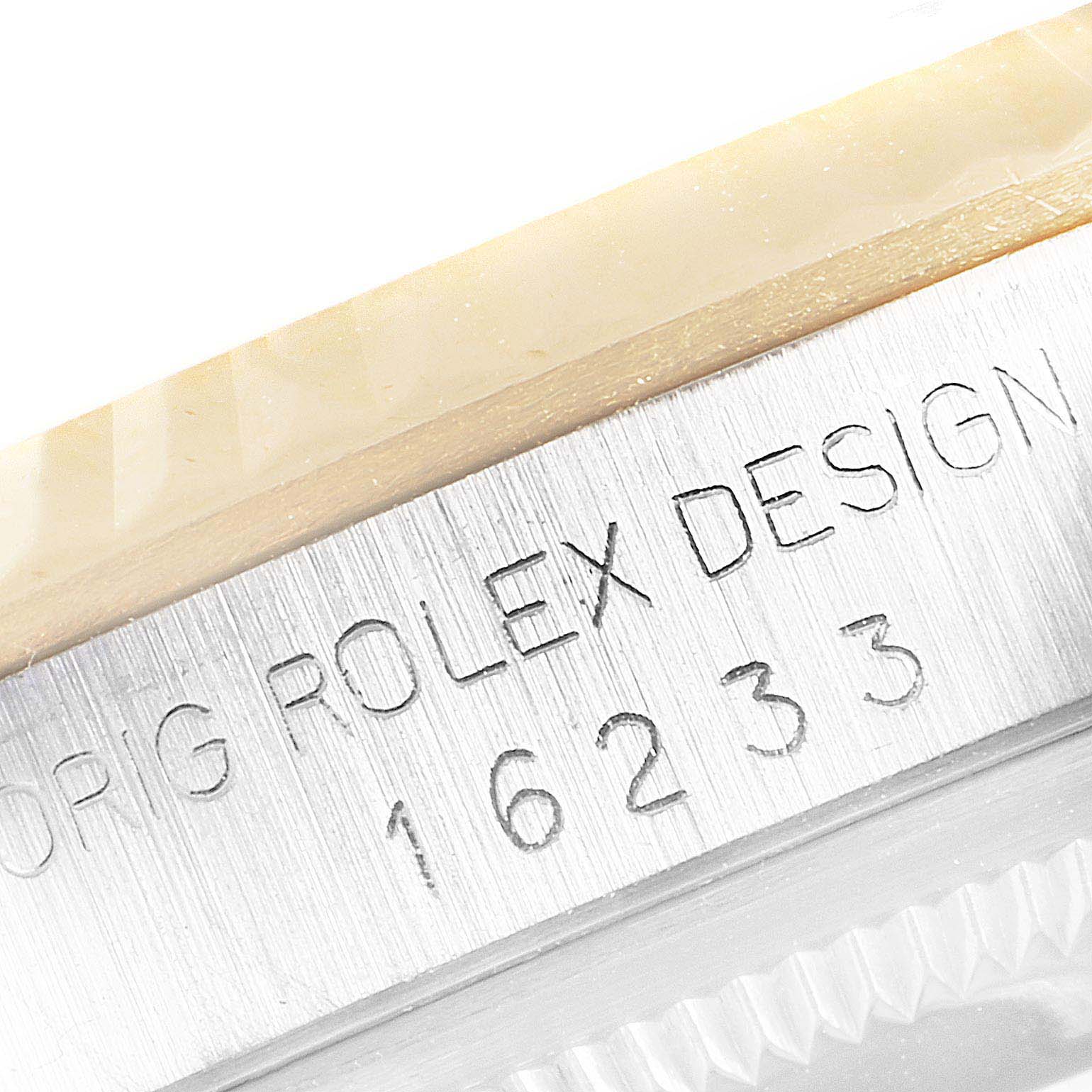 This close-up image shows the engraved model number "16233" on the side of the Rolex Datejust 16233 Men's Steel and Gold (two tone) Champagne Dial 16233 Men's Steel and Gold (two tone) Champagne Dial watch case.
