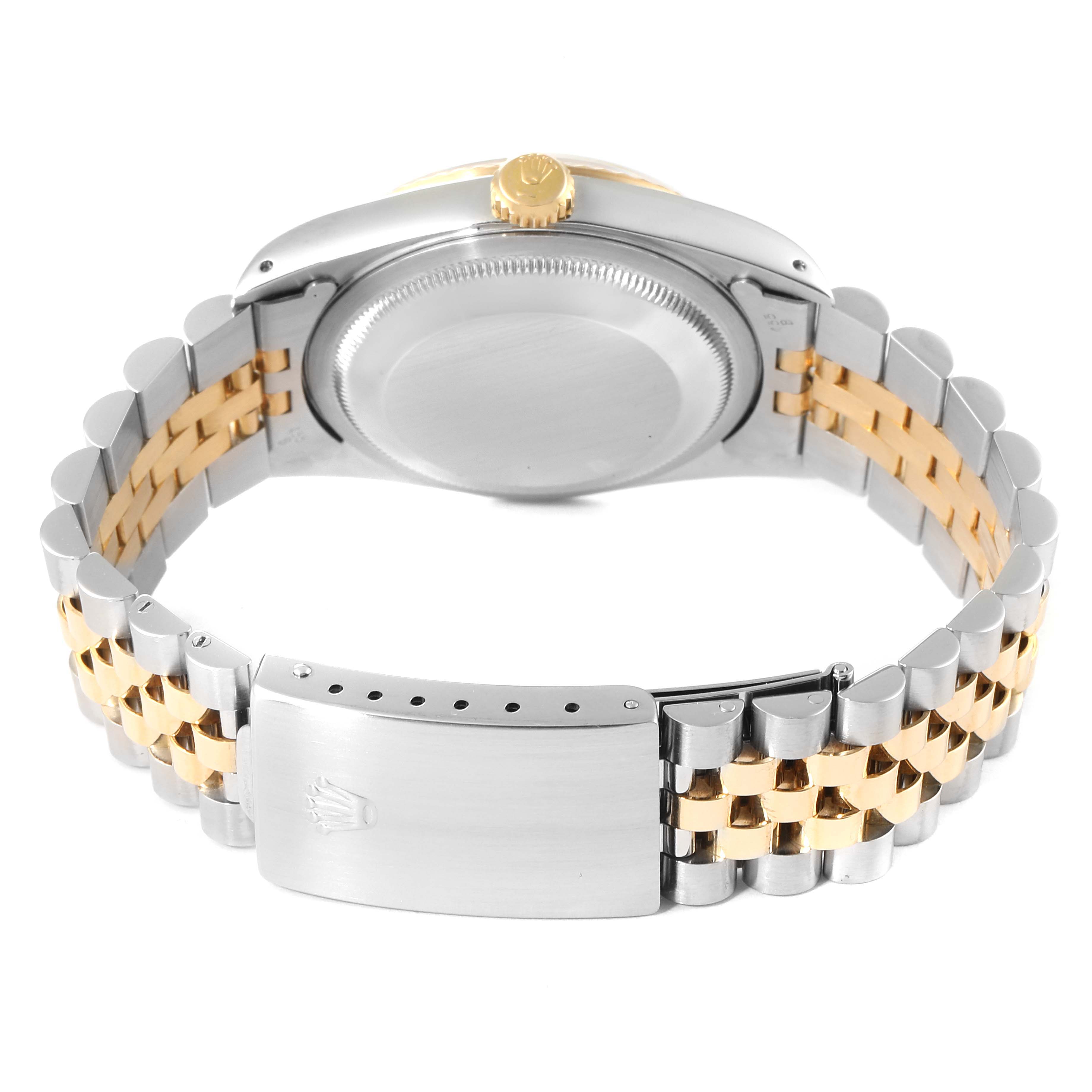 This image shows the back case, crown, and Jubilee bracelet of a Rolex Datejust 16233 Men's Steel and Gold (two tone) Champagne Dial 16233 Men's Steel and Gold (two tone) Champagne Dial watch.