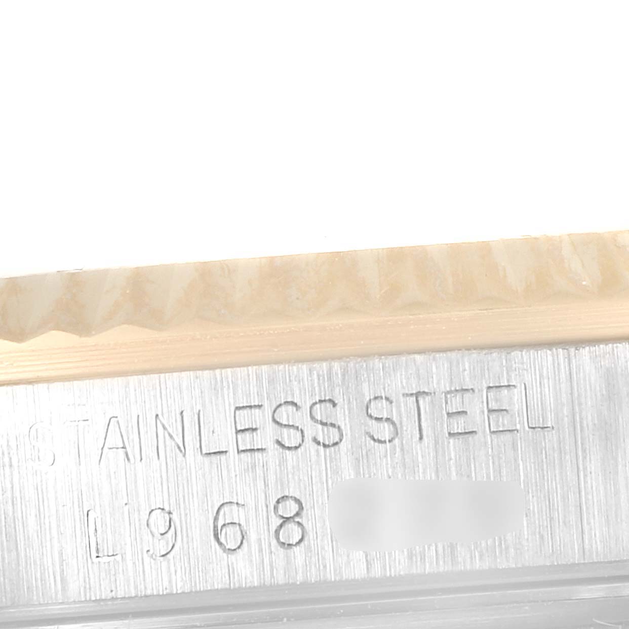 This close-up image shows a partial view of the bezel and the stainless steel case of a Rolex Datejust 16233 Men's Steel and Gold (two tone) Champagne Dial 16233 Men's Steel and Gold (two tone) Champagne Dial watch.