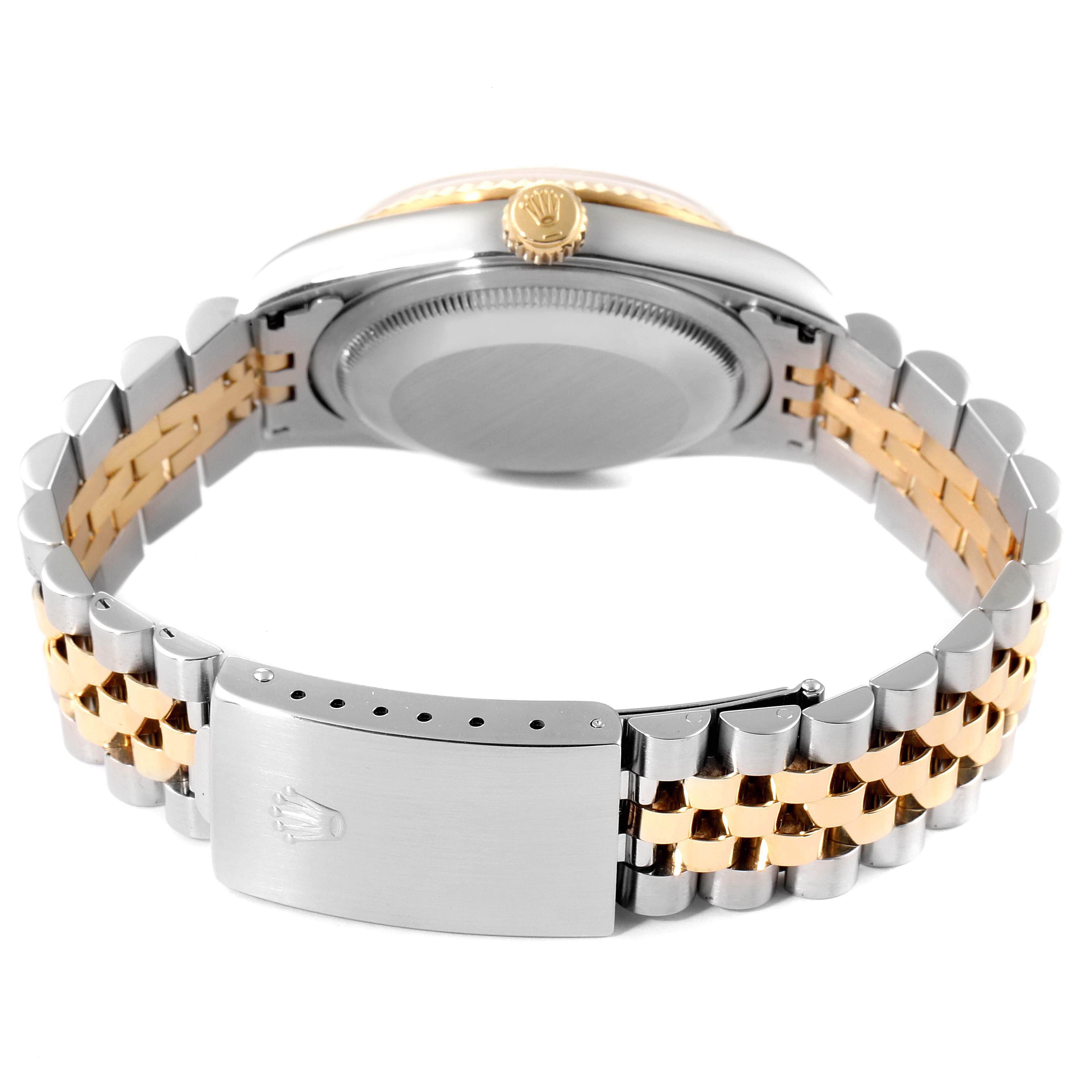 This image shows the Rolex Datejust 16233 Men's Steel and Gold (two tone) Mother of Pearl Dial 16233 Men's Steel and Gold (two tone) Mother of Pearl Dial watch from a bottom view, featuring the bracelet, clasp, and case back.