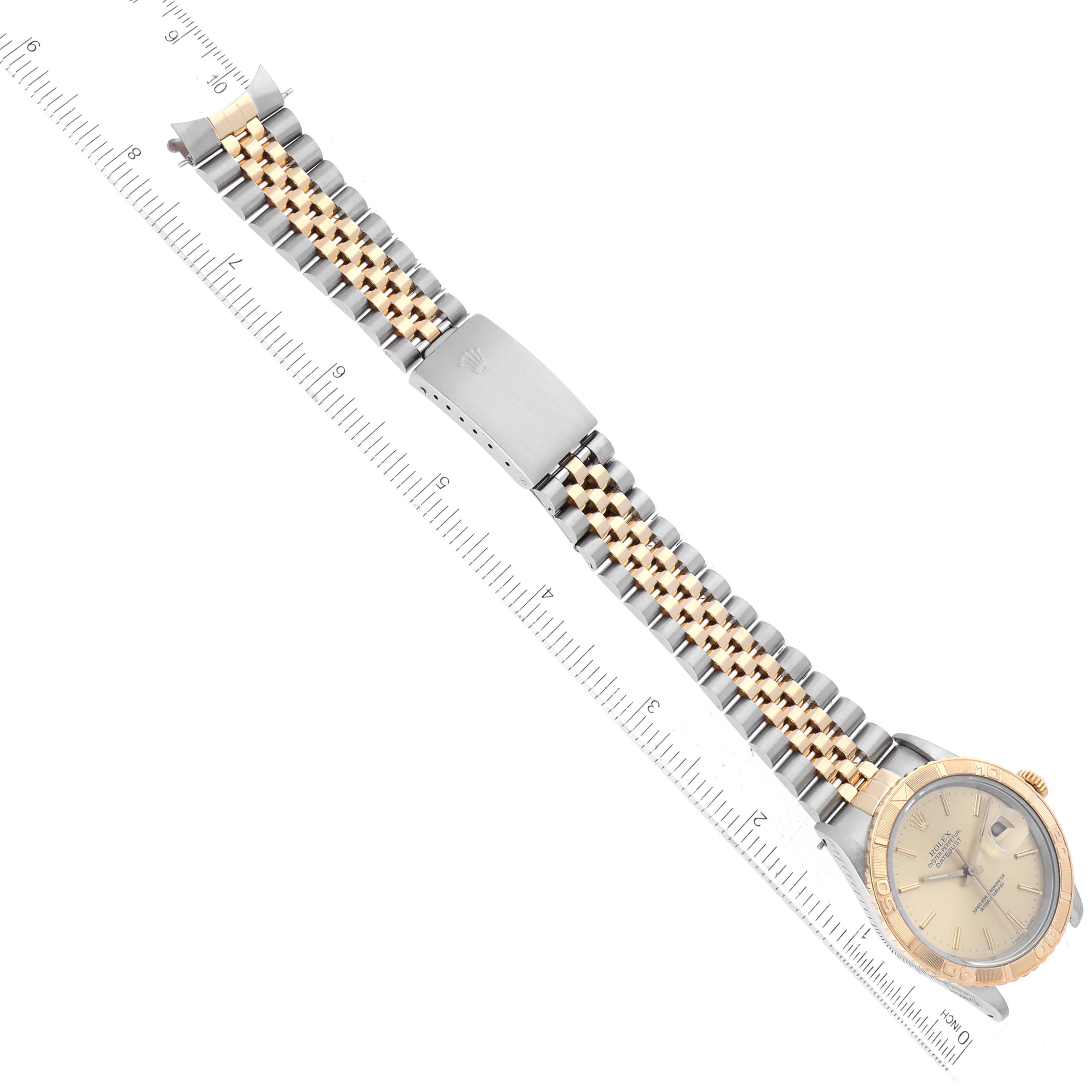 The image shows a top-down angle of a Rolex Turn-o-Graph 16263 Men
s Steel and Gold (two tone) Champagne Dial 16263 Men
s Steel and Gold (two tone) Champagne Dial watch, highlighting its face, bezel, and two-tone bracelet with clasp.