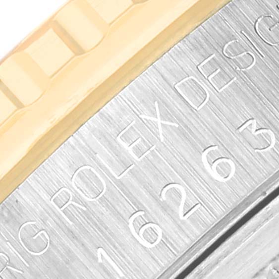 The image shows a close-up angled view of the bezel and casing with engraved text on a Rolex Turn-o-Graph 16263 Men
s Steel and Gold (two tone) Champagne Dial 16263 Men
s Steel and Gold (two tone) Champagne Dial watch.