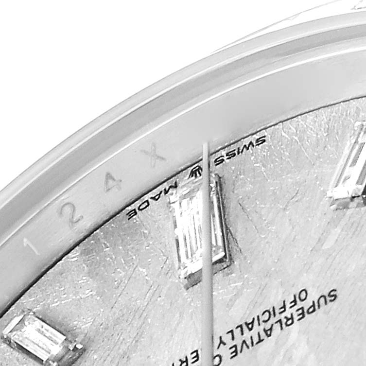 The image shows a close-up angled view of the dial and markers of a Rolex President 228396 Men
s Platinum Silver Dial watch.