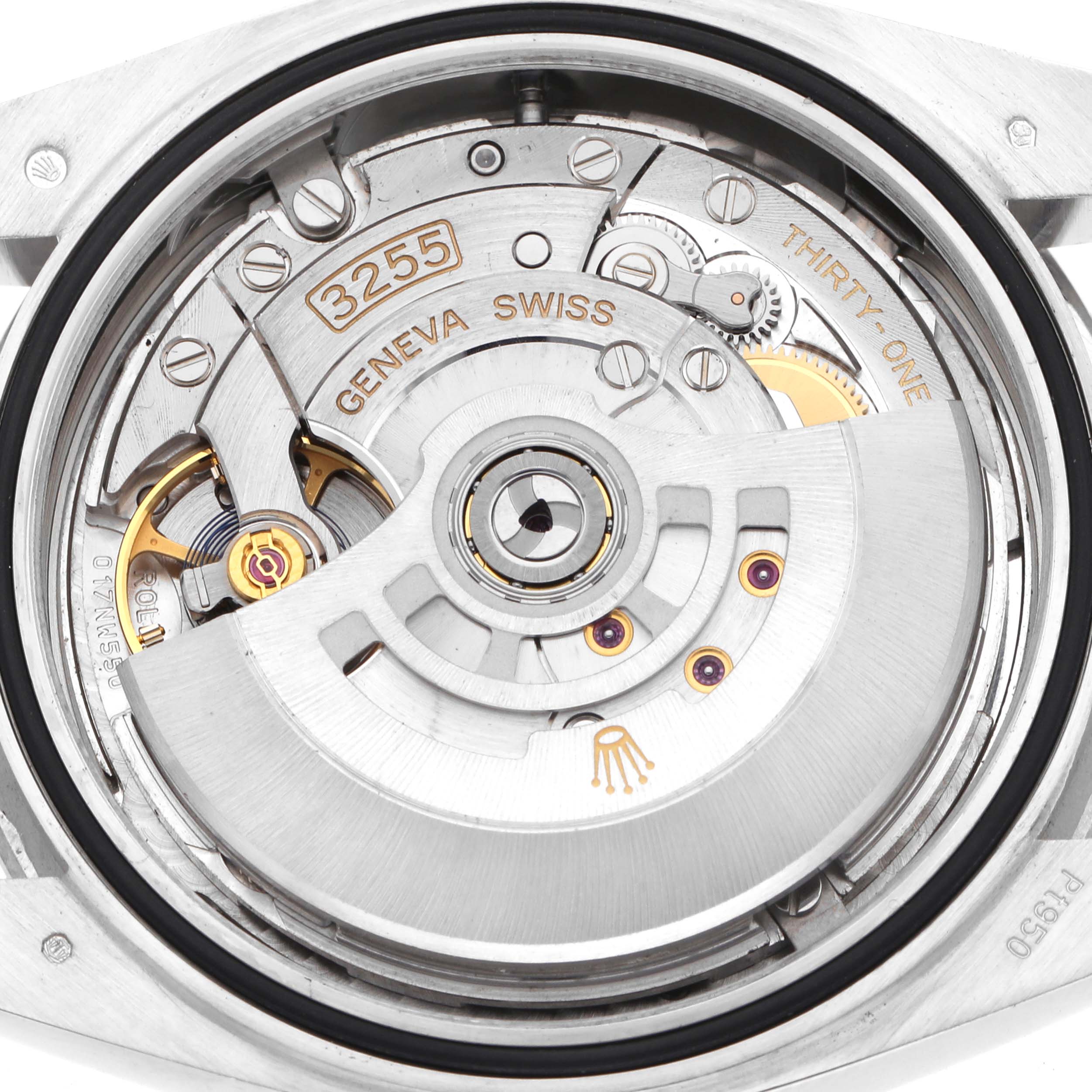 The image shows a close-up of the Rolex President 228396 Men
s Platinum Silver Dial model
s movement, highlighting its intricate gears and rotor.