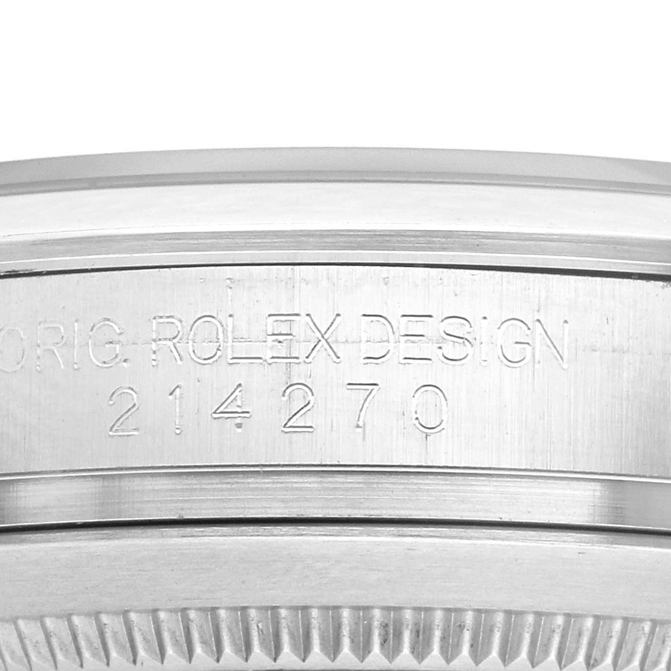 The image shows the side engraving of a Rolex Explorer 214270 Men
s Stainless Steel Black Dial watch, focusing on the model number "214270" and "ORIG. ROLEX DESIGN."