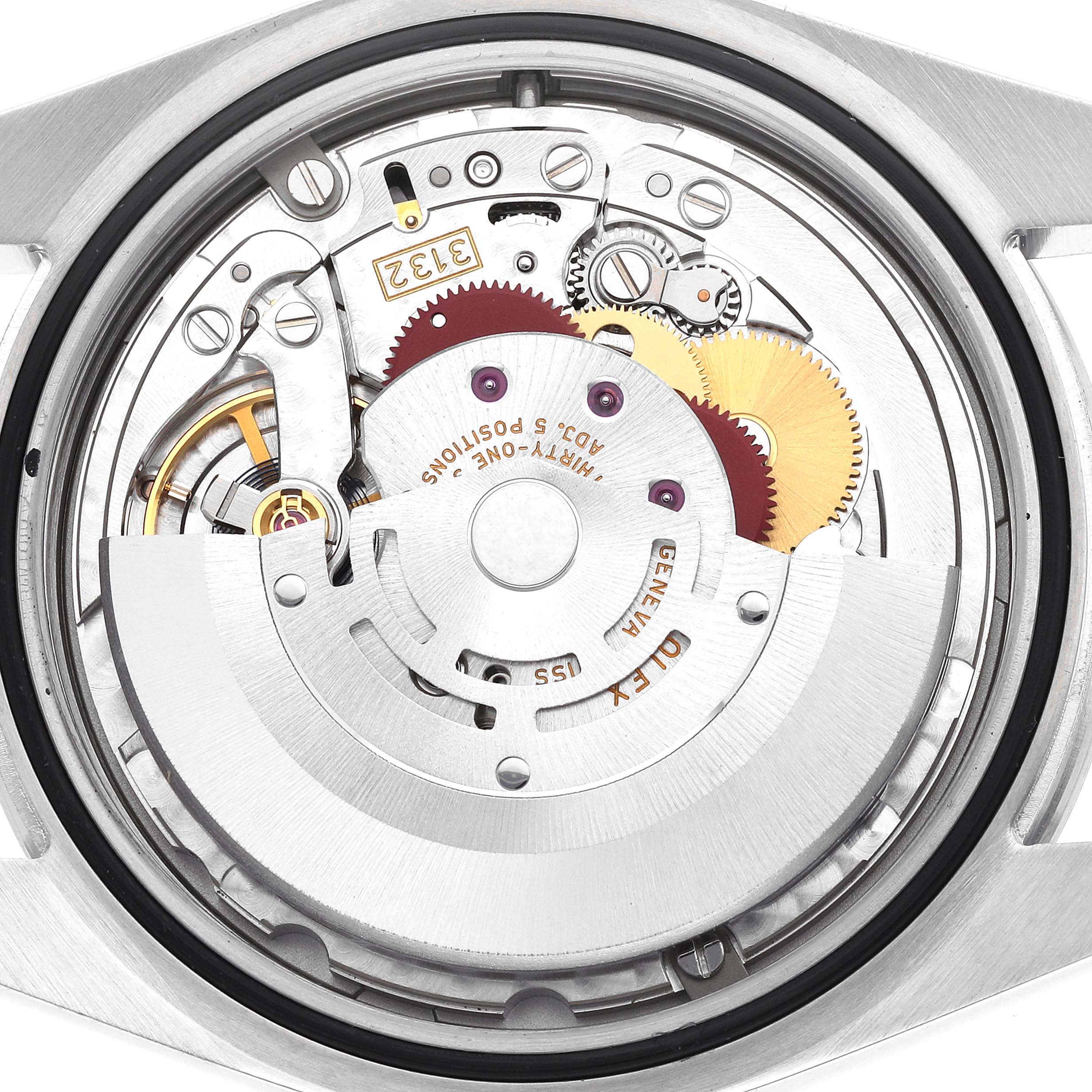 The image shows the movement mechanism of a Rolex Explorer 214270 Men
s Stainless Steel Black Dial watch viewed from the back, highlighting gears, rotors, and inscriptions.