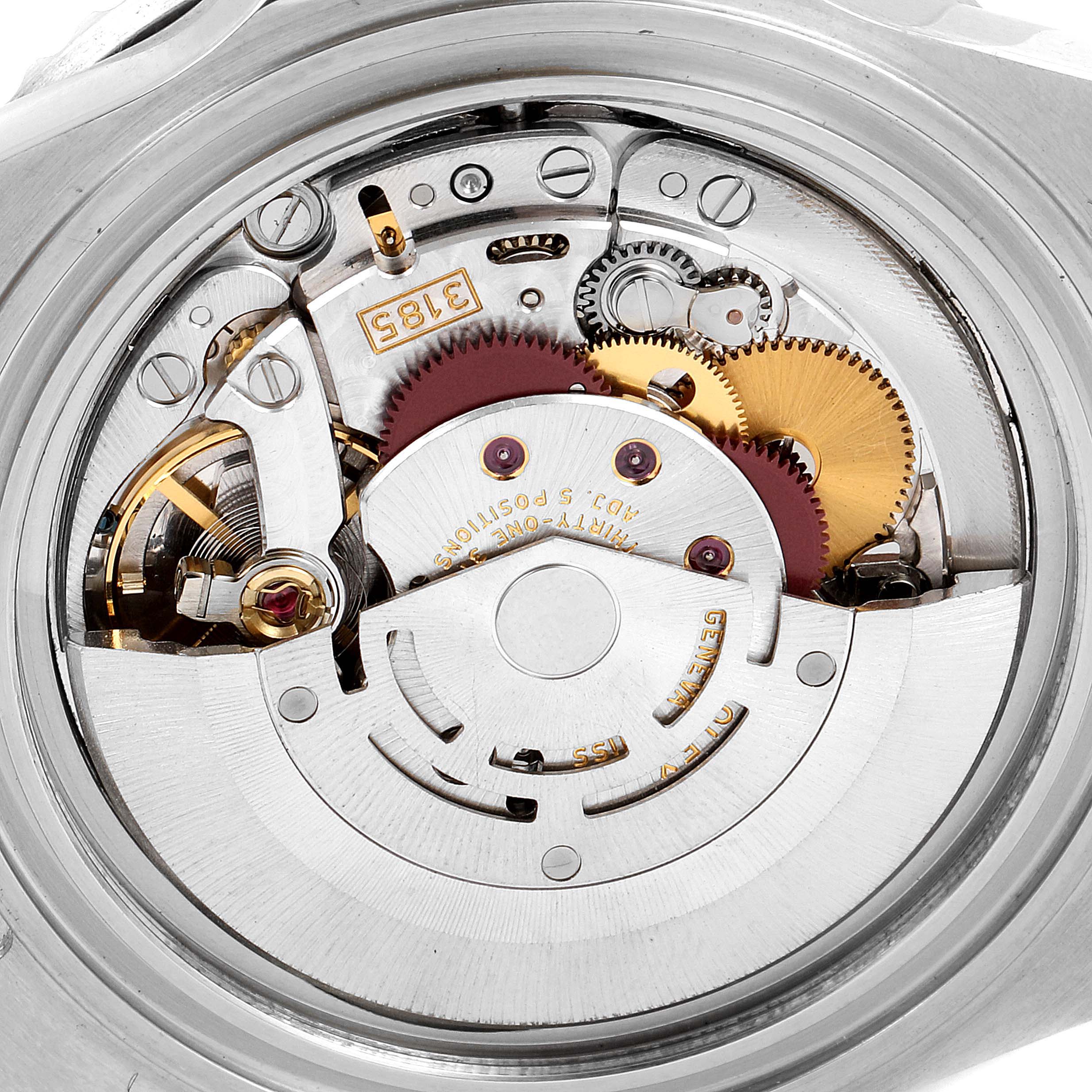 This image shows the internal mechanism of a Rolex GMT-Master 16710 Men
s Stainless Steel Black Dial 16710 Men
s Stainless Steel Black Dial watch from a close-up angle, highlighting the gears and intricate details.