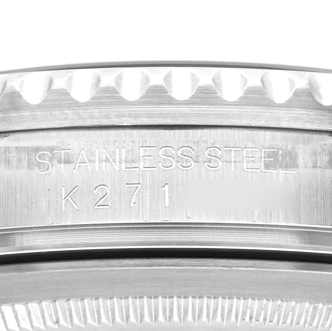 This image shows a close-up view of the case back of a Rolex GMT-Master 16710 Men
s Stainless Steel Black Dial 16710 Men
s Stainless Steel Black Dial watch, displaying the "STAINLESS STEEL" engraving.