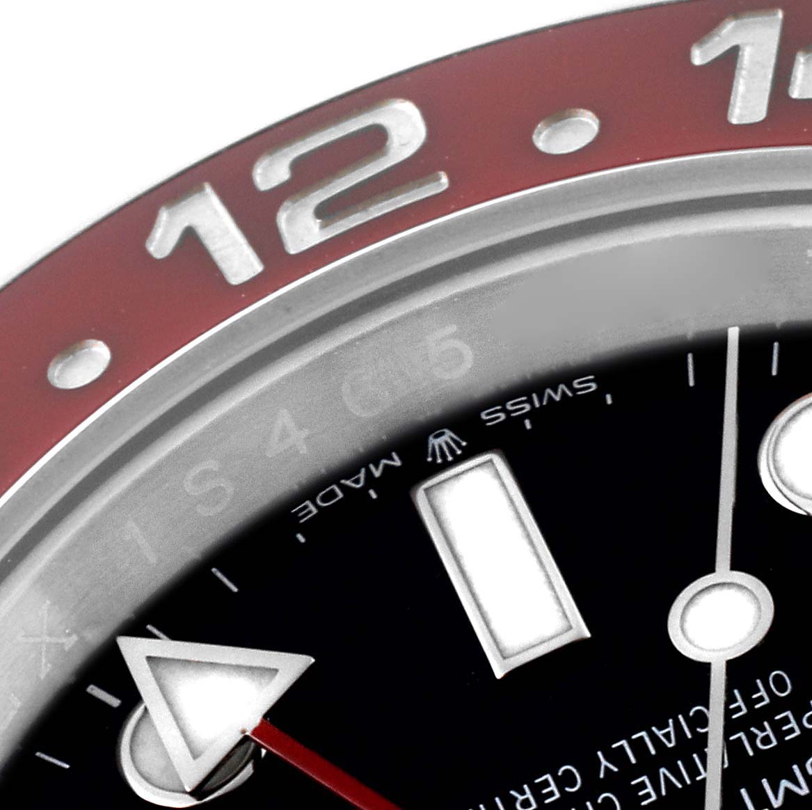 This close-up angle of the Rolex GMT-Master 126710BLRO Men's Stainless Steel Black Dial 126710BLRO Men's Stainless Steel Black Dial watch shows part of the bezel, dial, and hour markers.